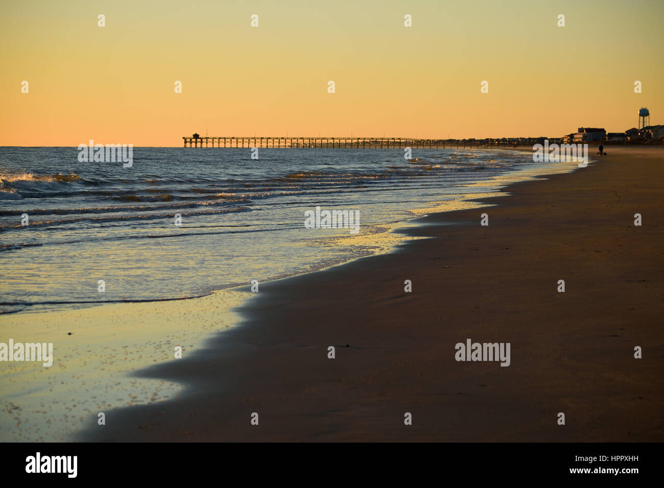 Sunset beyond the Oak Island, NC, fishing pier Stock Photo Alamy