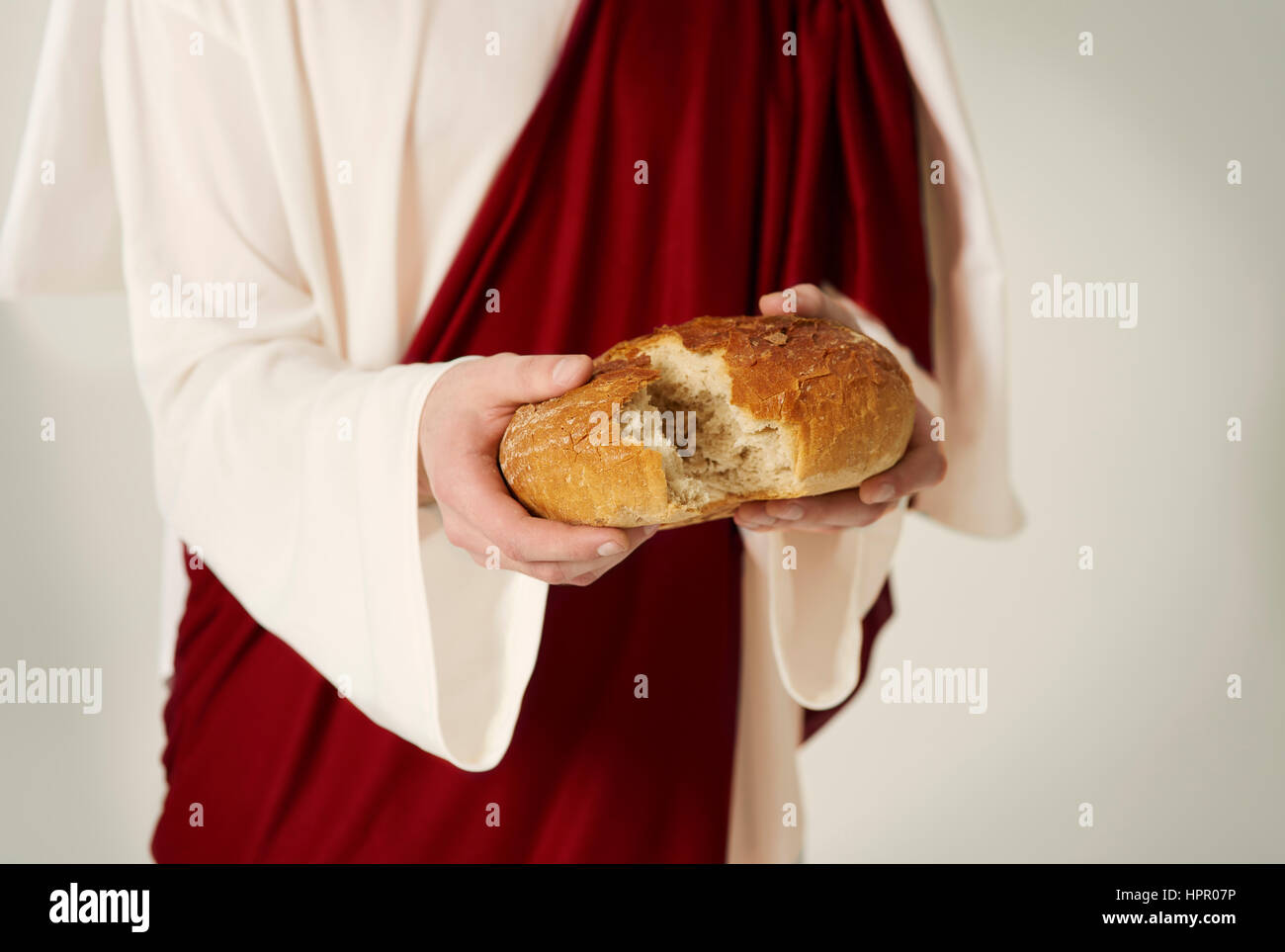 Close up of Jesus hands with bread of life Stock Photo