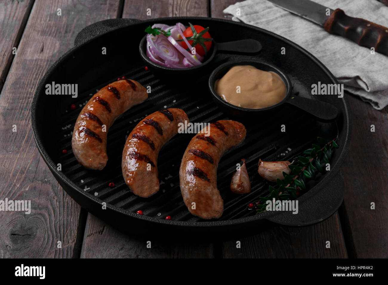 homemade grilled sausage with spices on grill Stock Photo