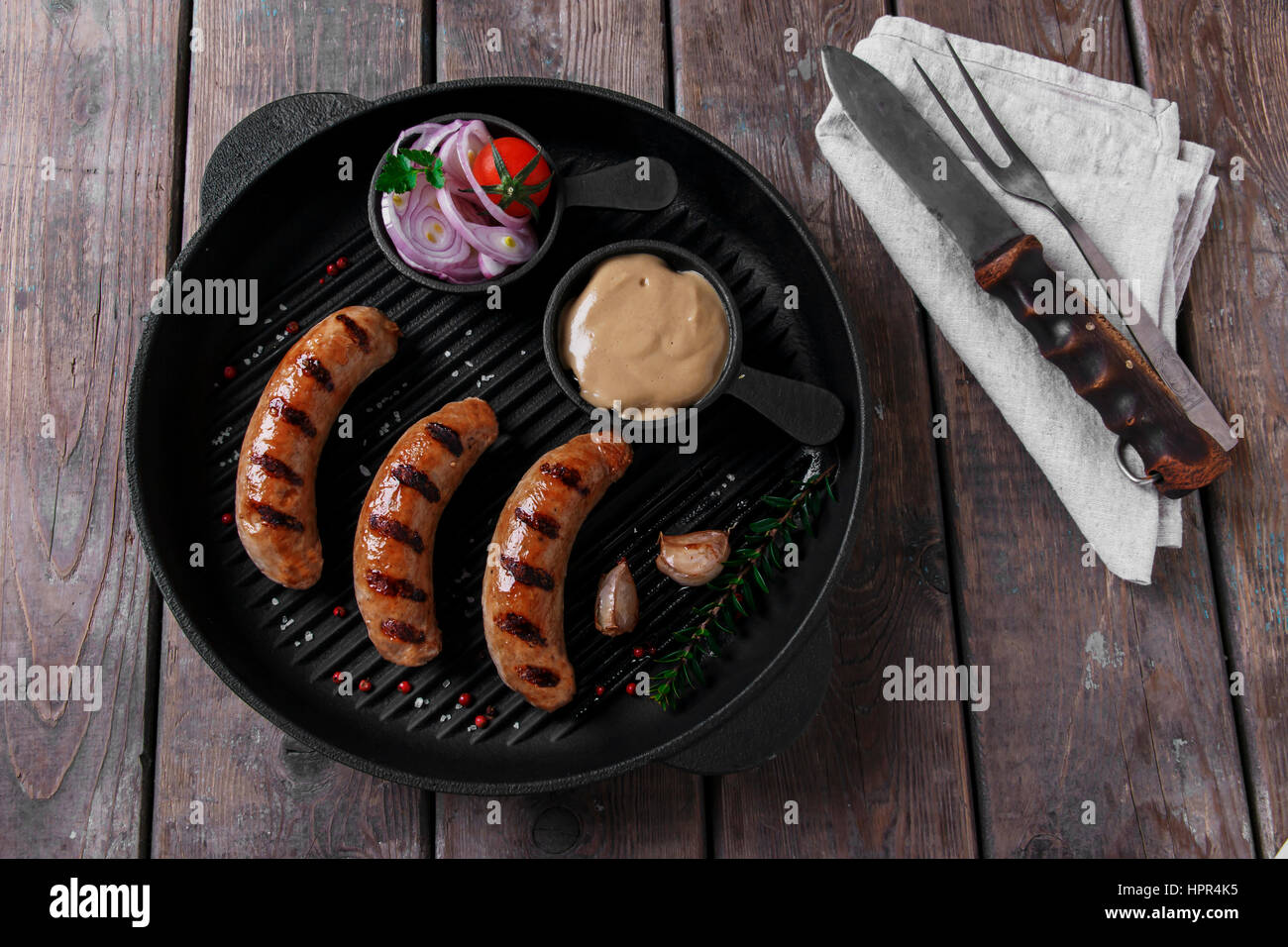 homemade grilled sausage with spices on grill Stock Photo