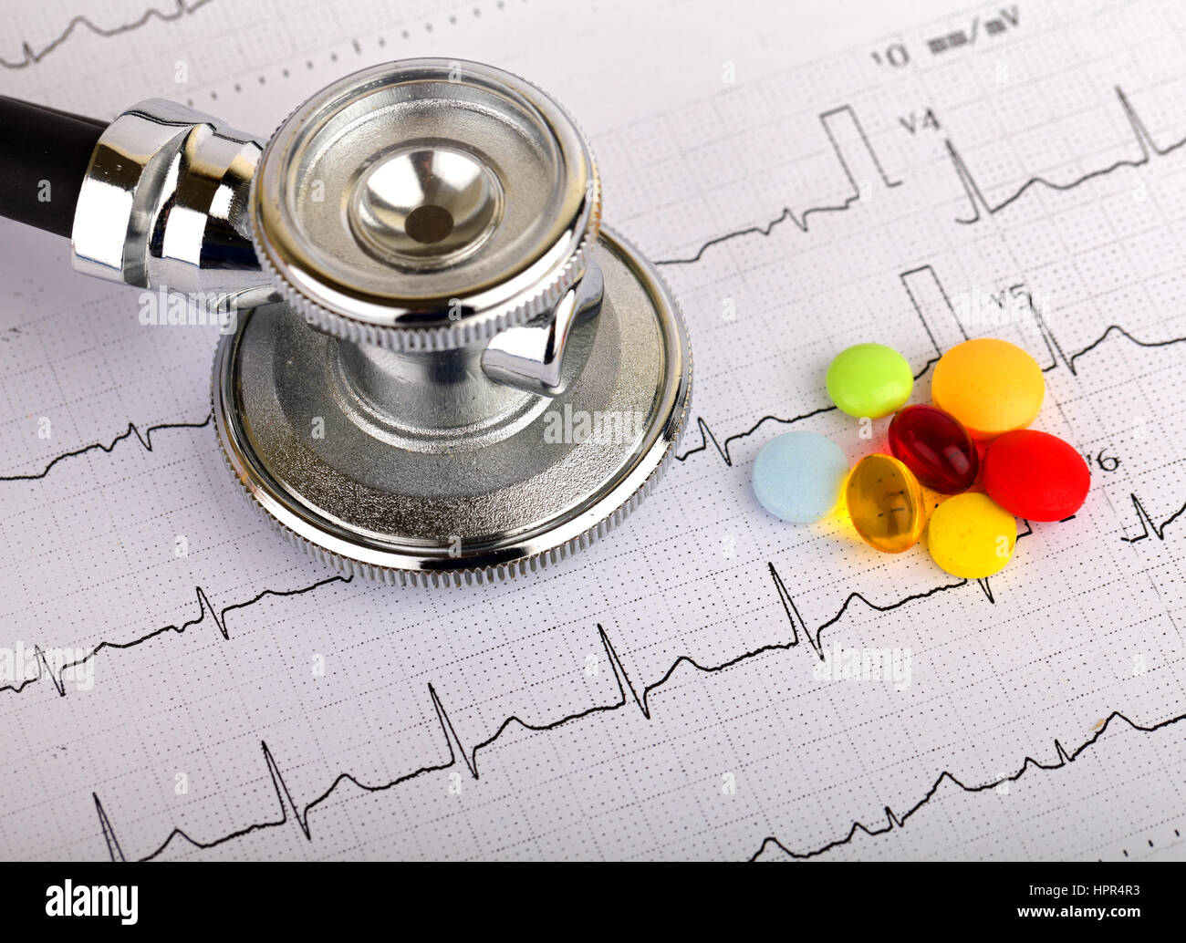 Electrocardiogram graph report with stethoscope on it Stock Photo