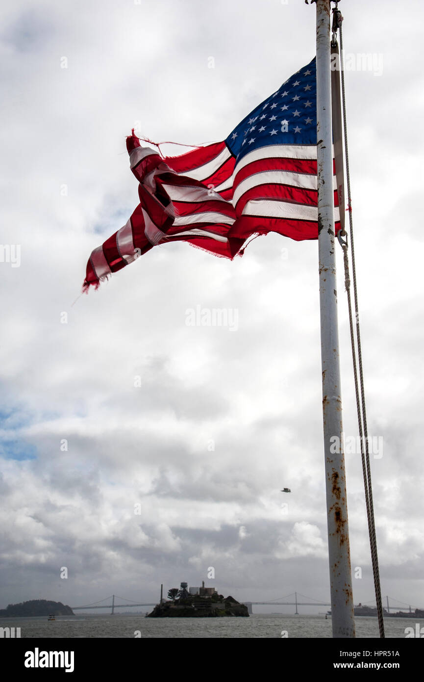 Flag fluttering from back of ferry boat in San Francisco Bay, California Stock Photo