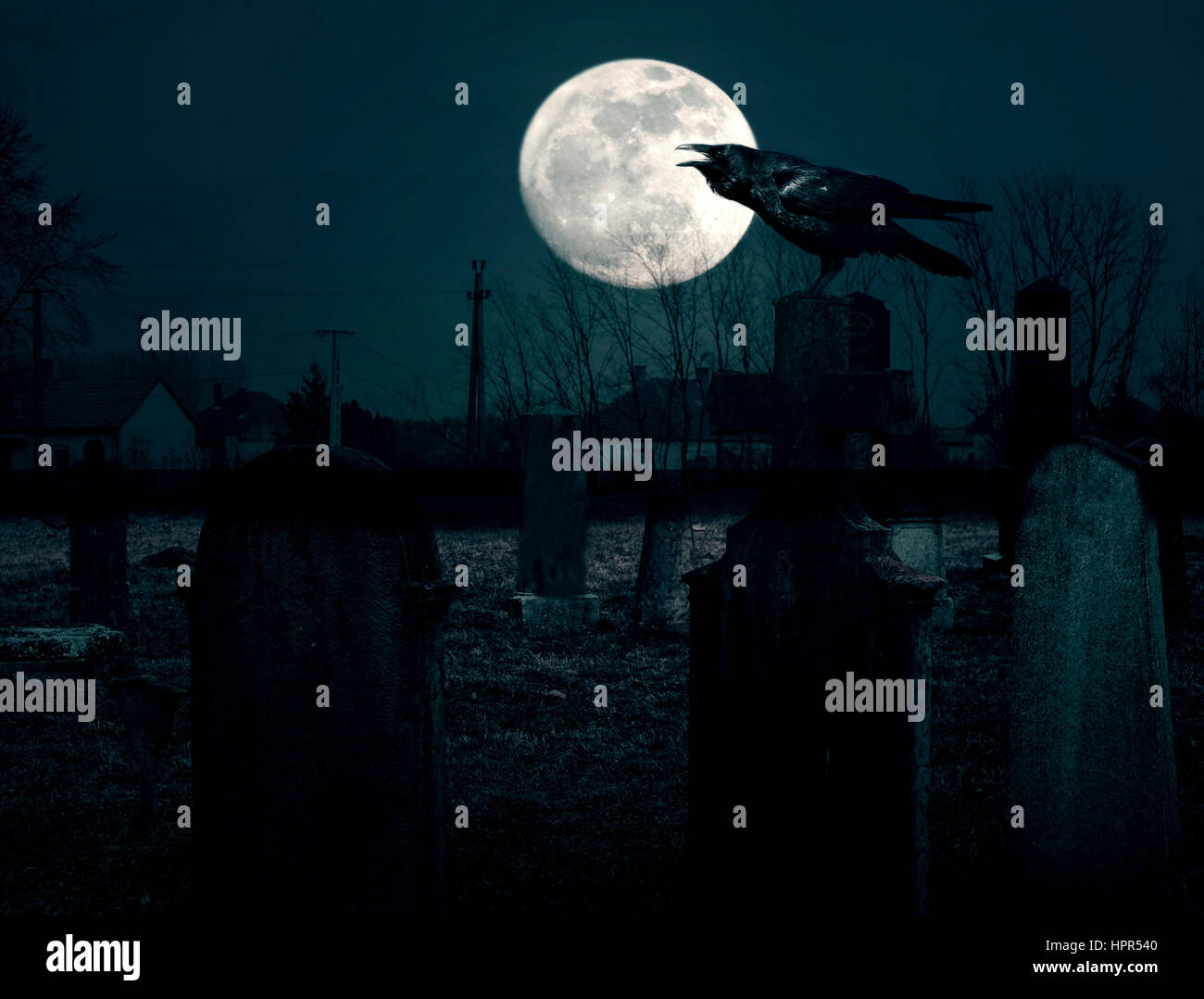 Spooky cemetery at night Stock Photo