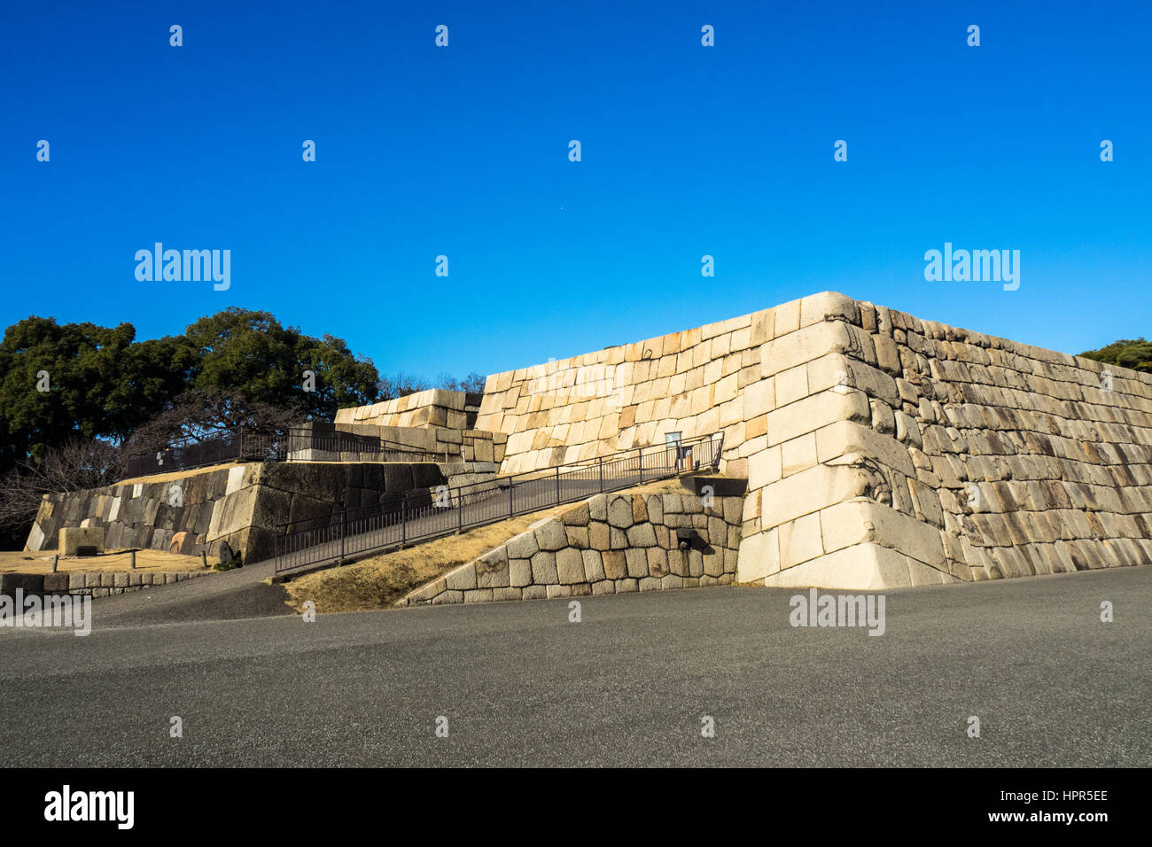 Granite stone forming the foundations of the Edo castle tower in the East gardens of the Tokyo Imperial Palace grounds. Stock Photo