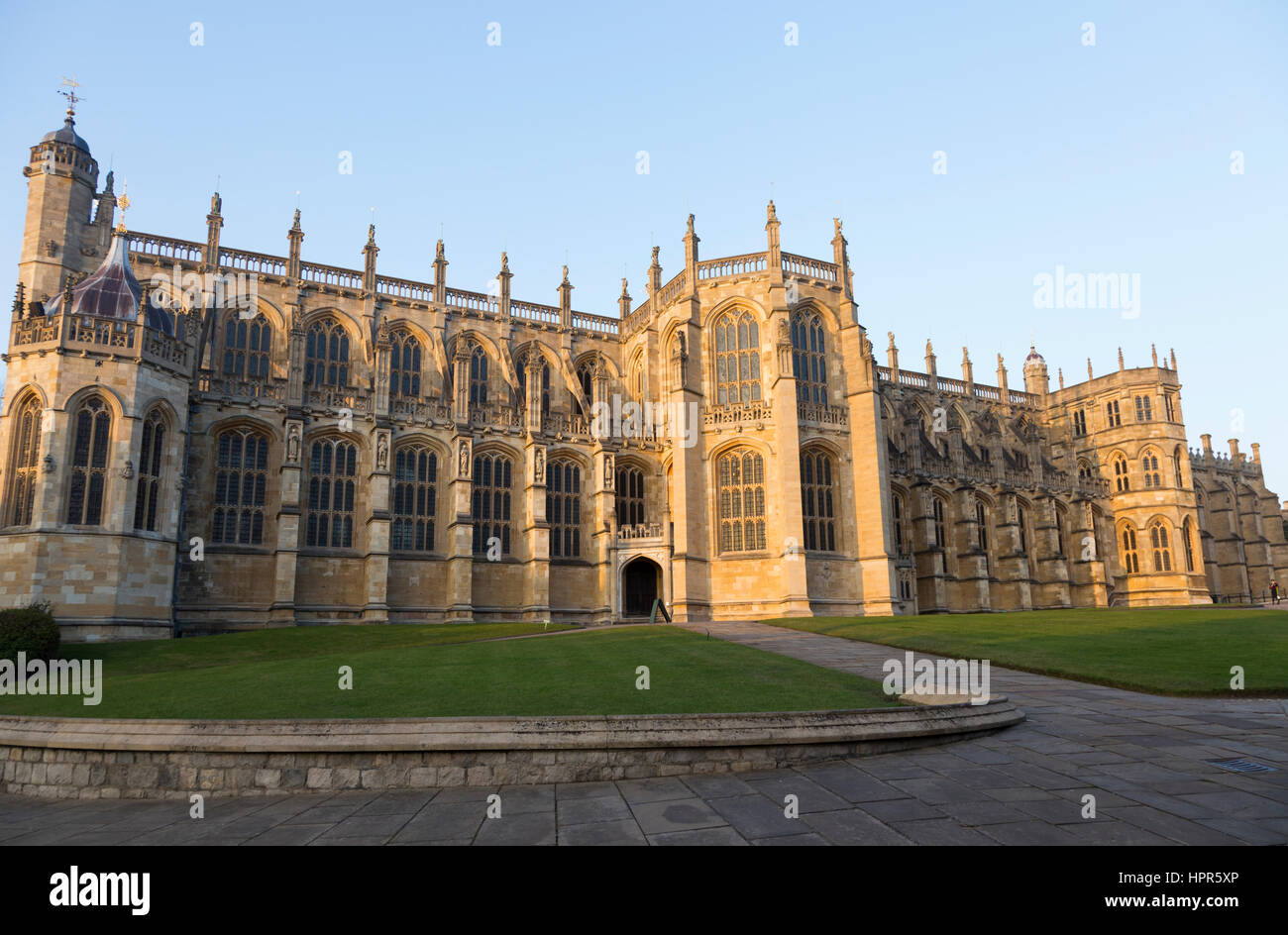 The south facade / southern aspect of Saint George's Chapel, inside Windsor Castle. Windsor, Berkshire. UK. On sunny day with sun & blue sky / skies. Stock Photo