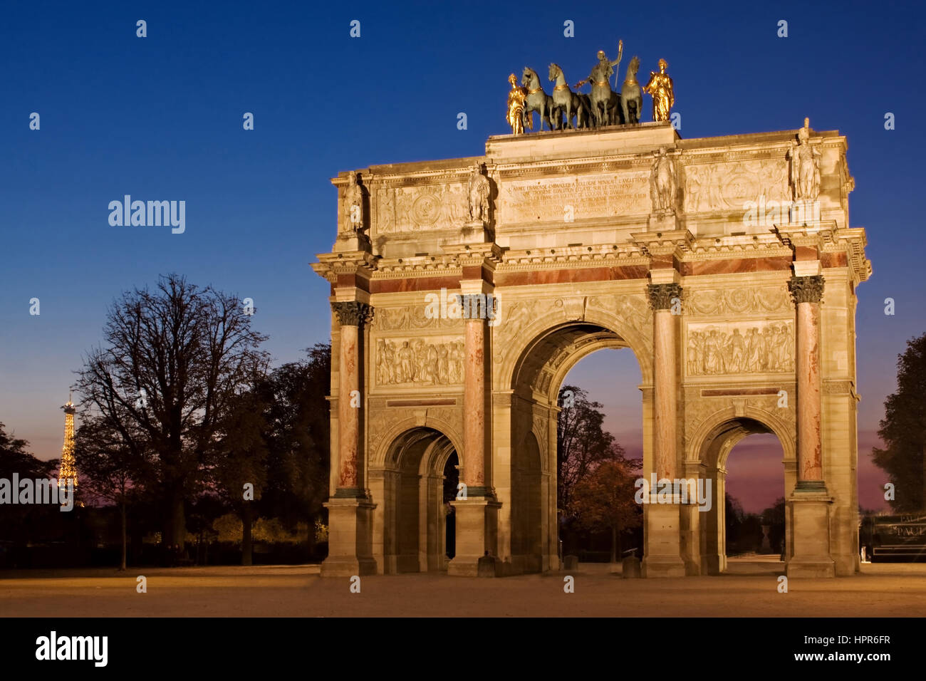 Night View Of The Arc De Triomphe Du Carrousel Near The Louvre Museum In Paris France The Eiffel Tower Can Just Be Seen In The Distance To The Left Stock Photo