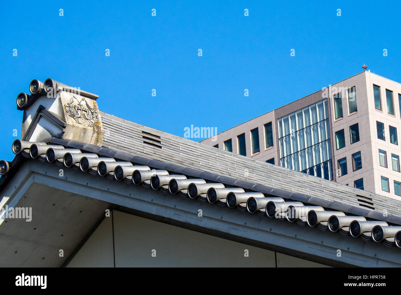 Ornate roof and gable of a bansho East Gardens of the Tokyo Imperial Palace. Stock Photo
