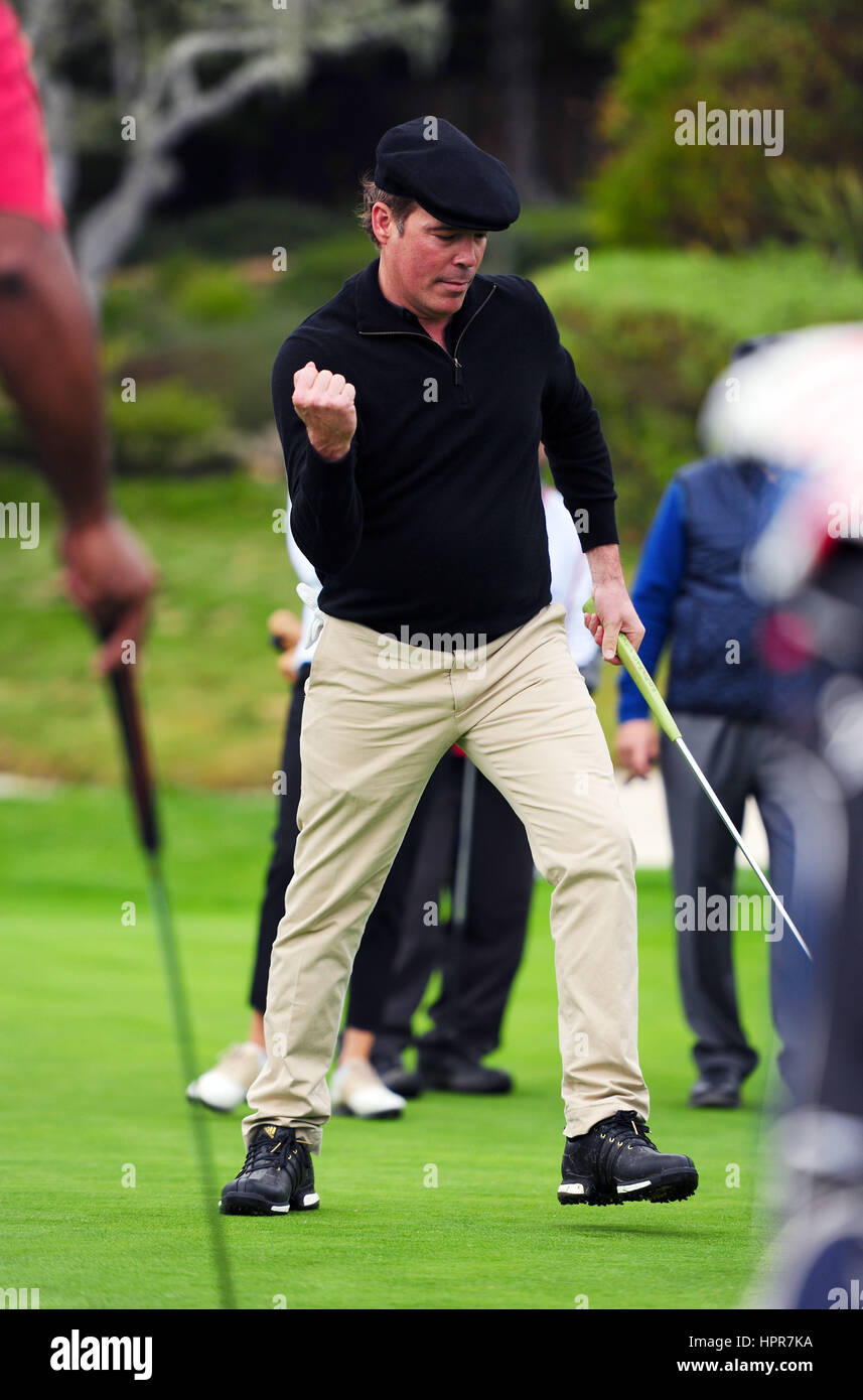 Country music star Clay Walker reacts after sinking a putt during the AT&T Pebble Beach National Pro-Am golf tournament February 8, 2017 in Monterey, California. Stock Photo