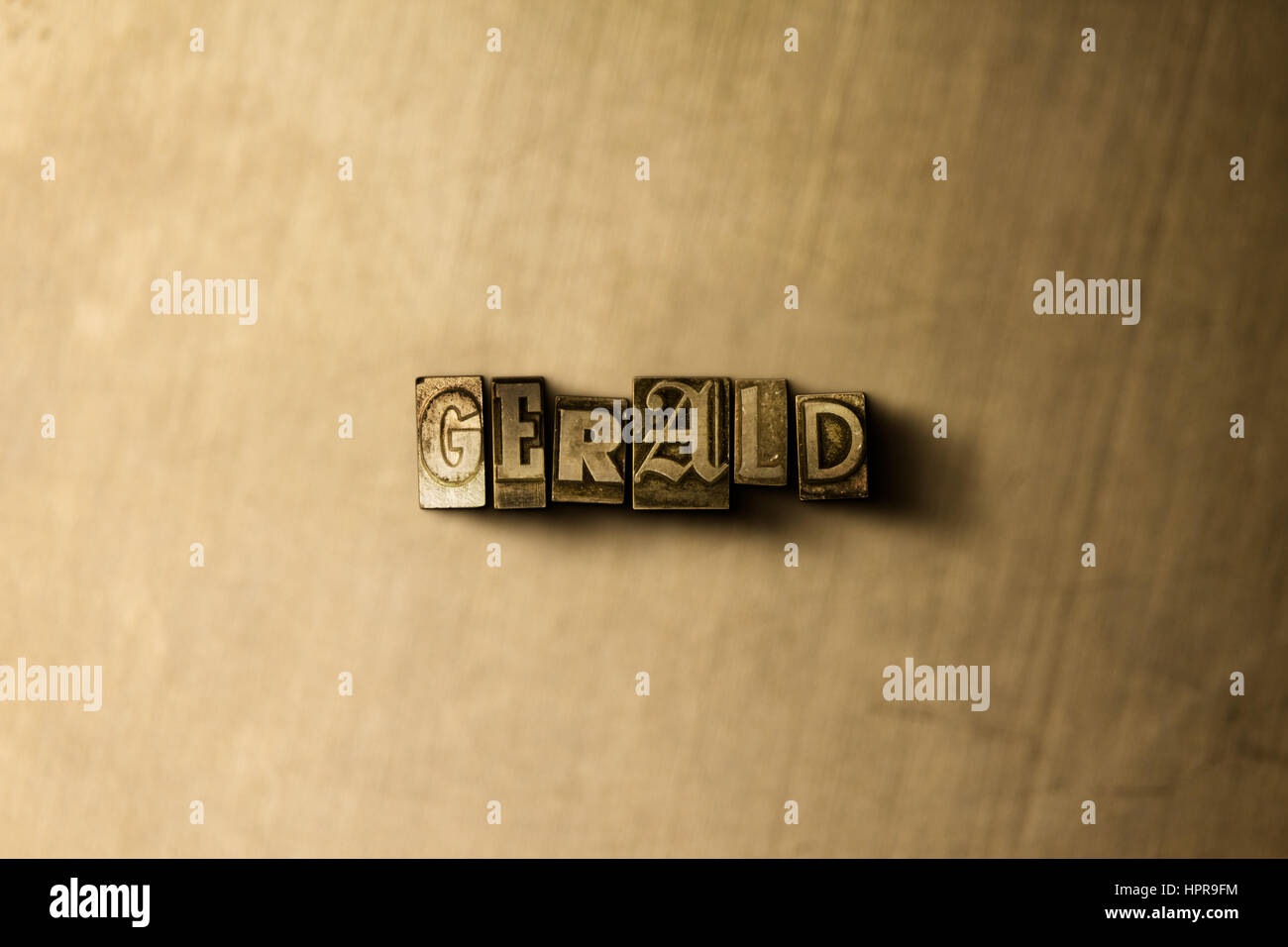 GERALD - close-up of grungy vintage typeset word on metal backdrop ...