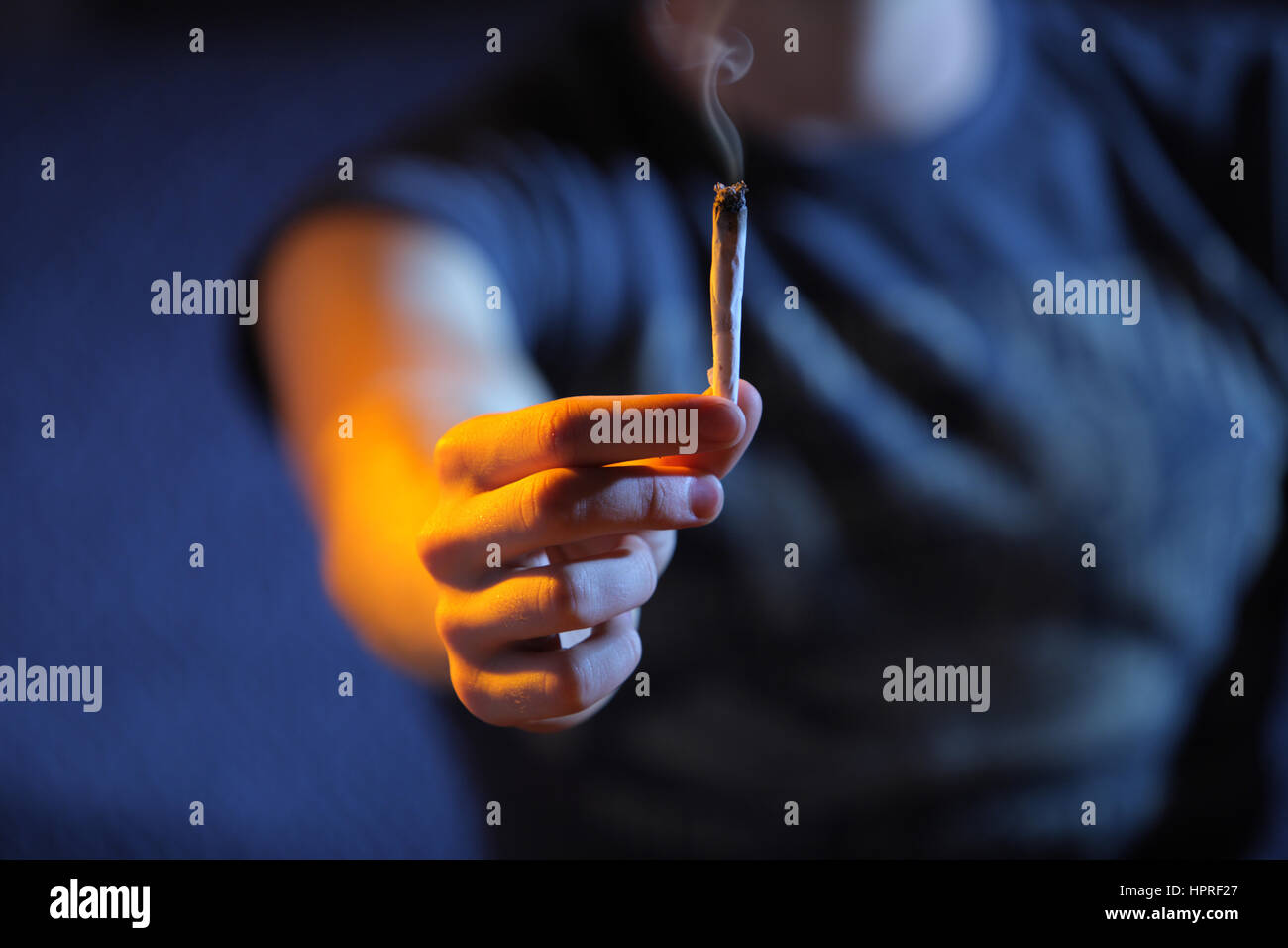 Smoking joint. Hand close up. Copy space Stock Photo Alamy