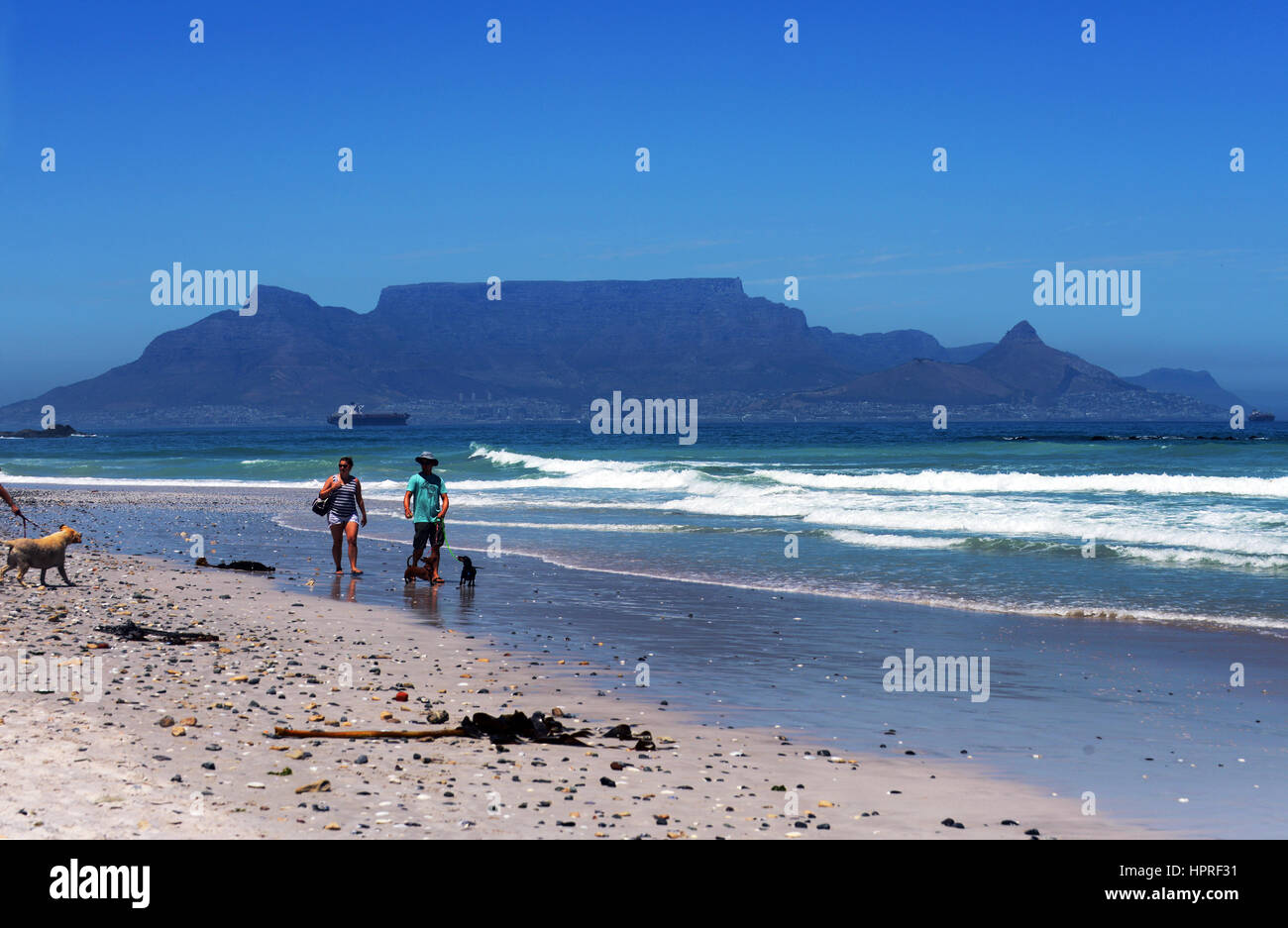 Summer on Bloubergstrand beach with a stunning view of the Table Mountain range in the back. Stock Photo