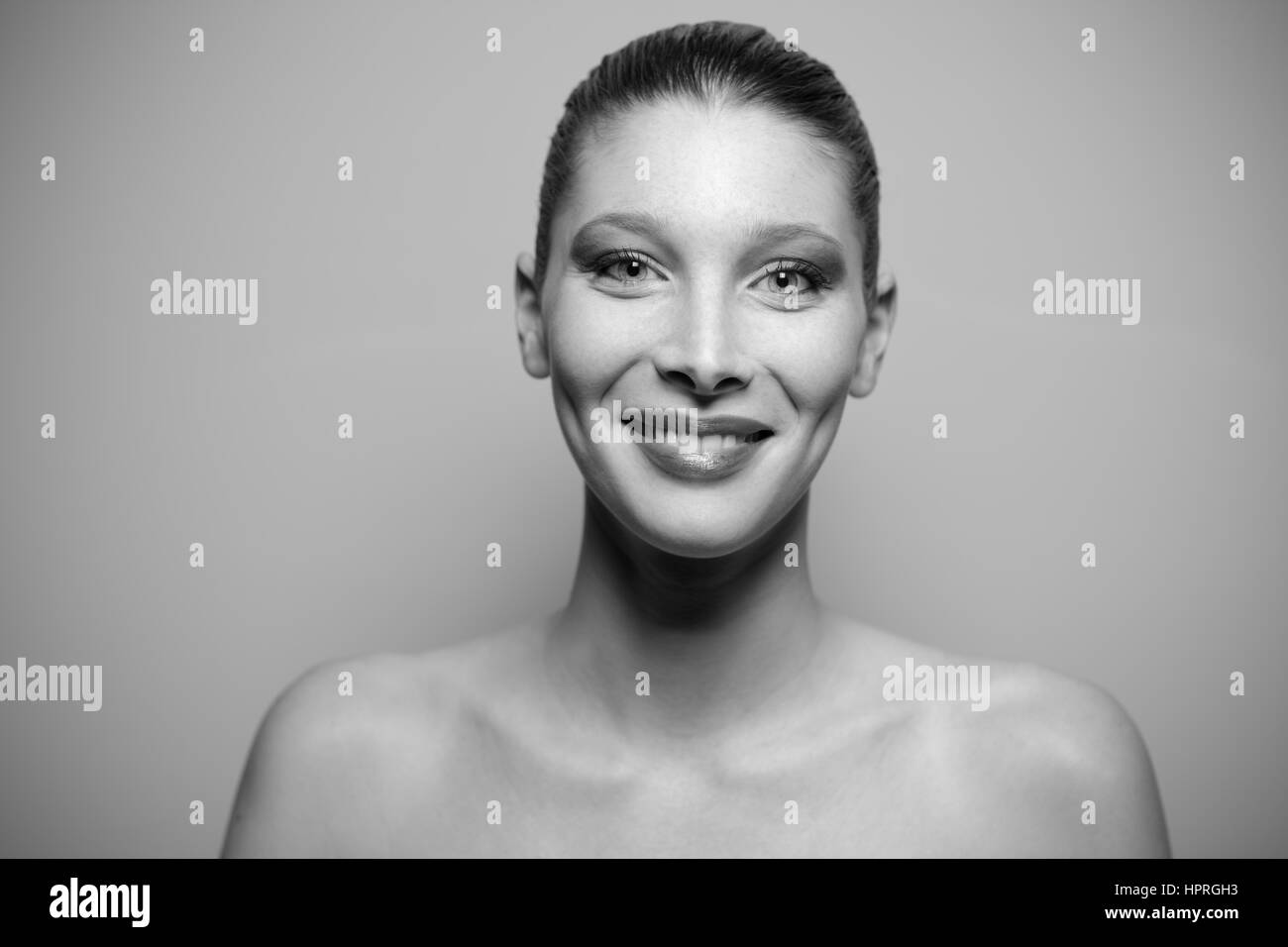 Portrait of a young beautiful woman smiling, black and white picture ...