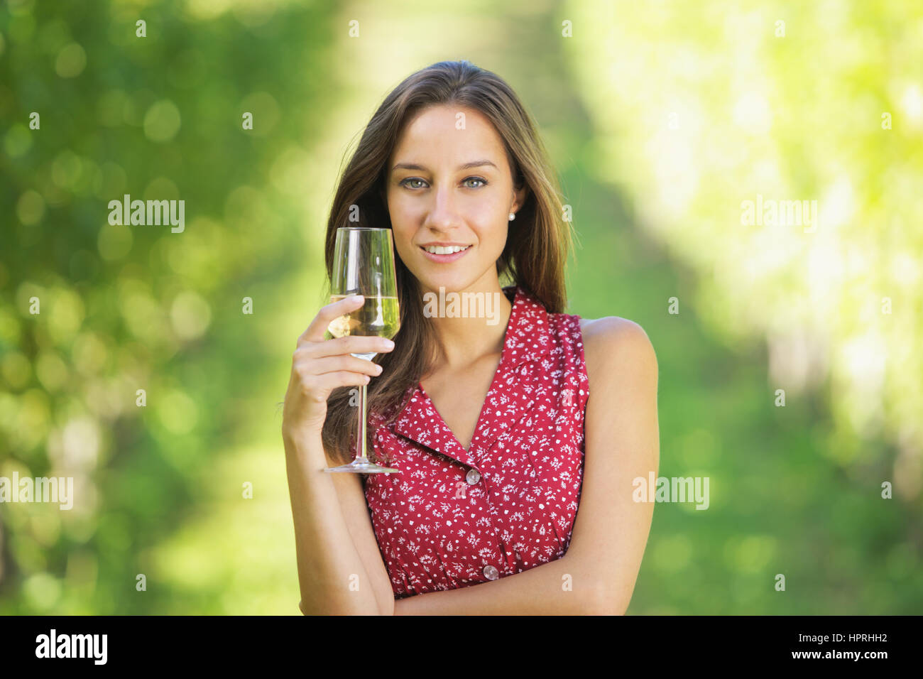 Portrait of woman in vineyard with a glass of champagne Stock Photo - Alamy