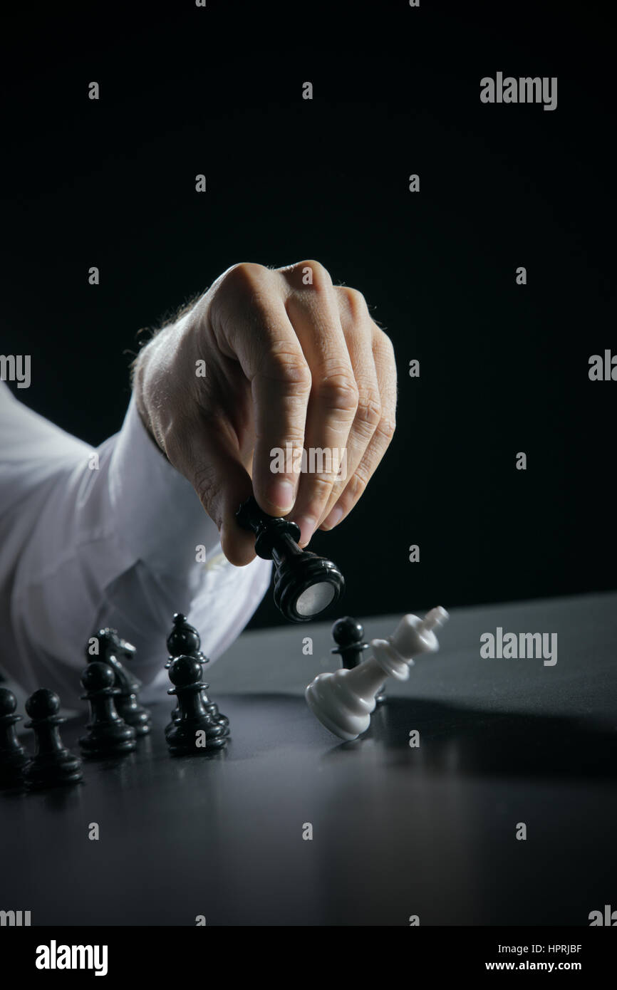 Hand Of A Man Taking A Chess Piece To Make The Next Move In A Chess Game.  Close Up. Spring Day Outside. Stock Photo, Picture and Royalty Free Image.  Image 198493516.