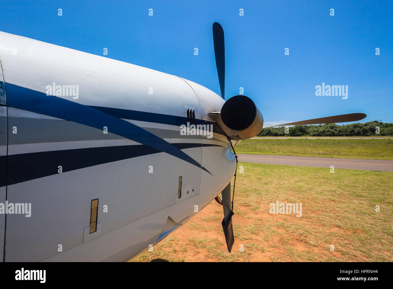 Plane twin engine propellor aircraft closeup rear front abstract on countryside airstrip summers day Stock Photo