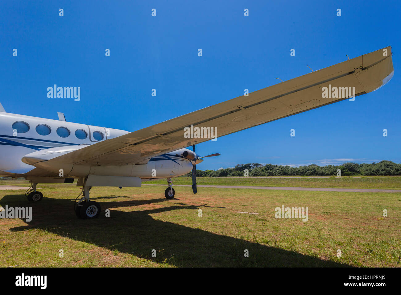 Plane twin engine propellor aircraft closeup rear front abstract on countryside airstrip summers day Stock Photo