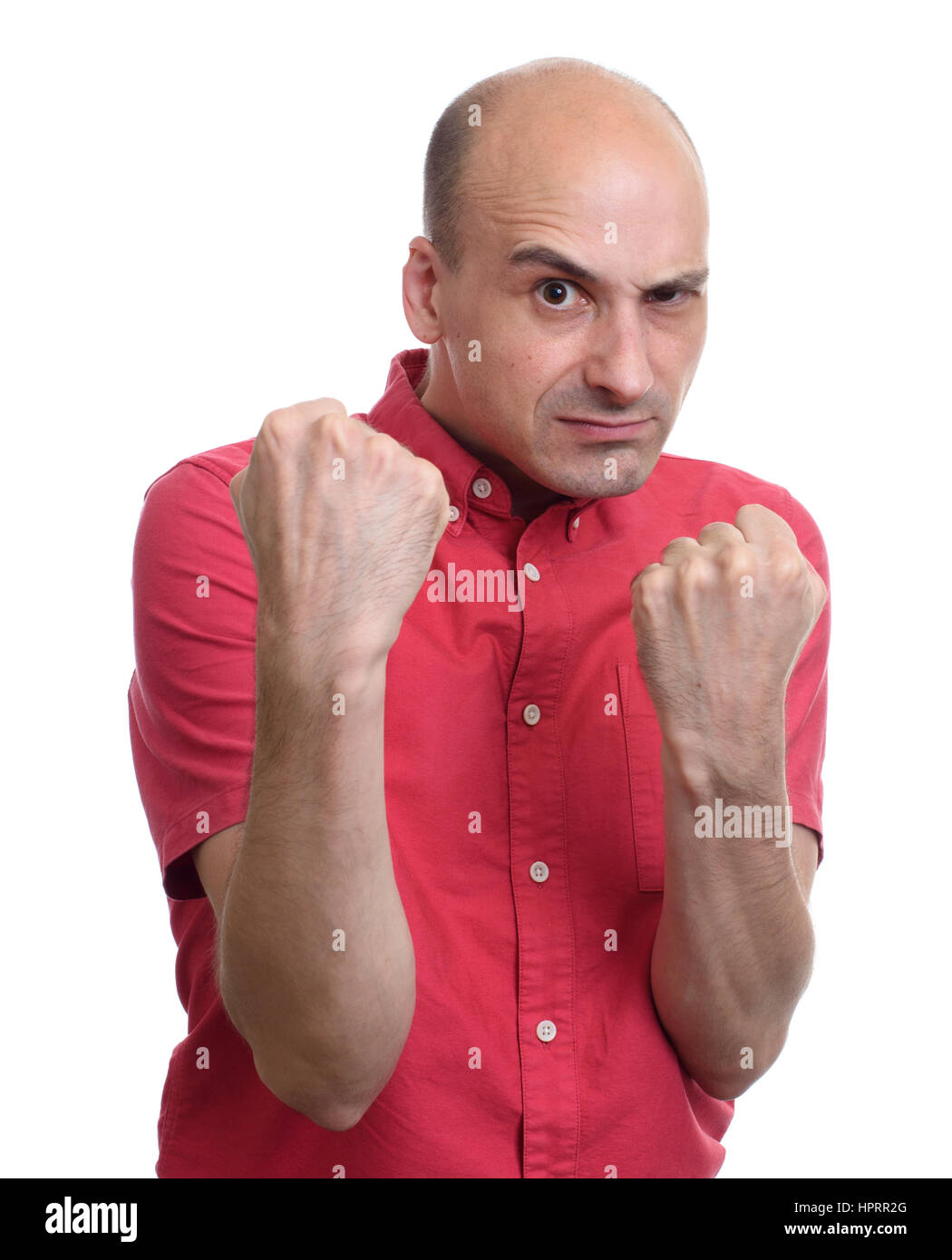 Angry bald man ready for a fight. Isolated on white background Stock Photo