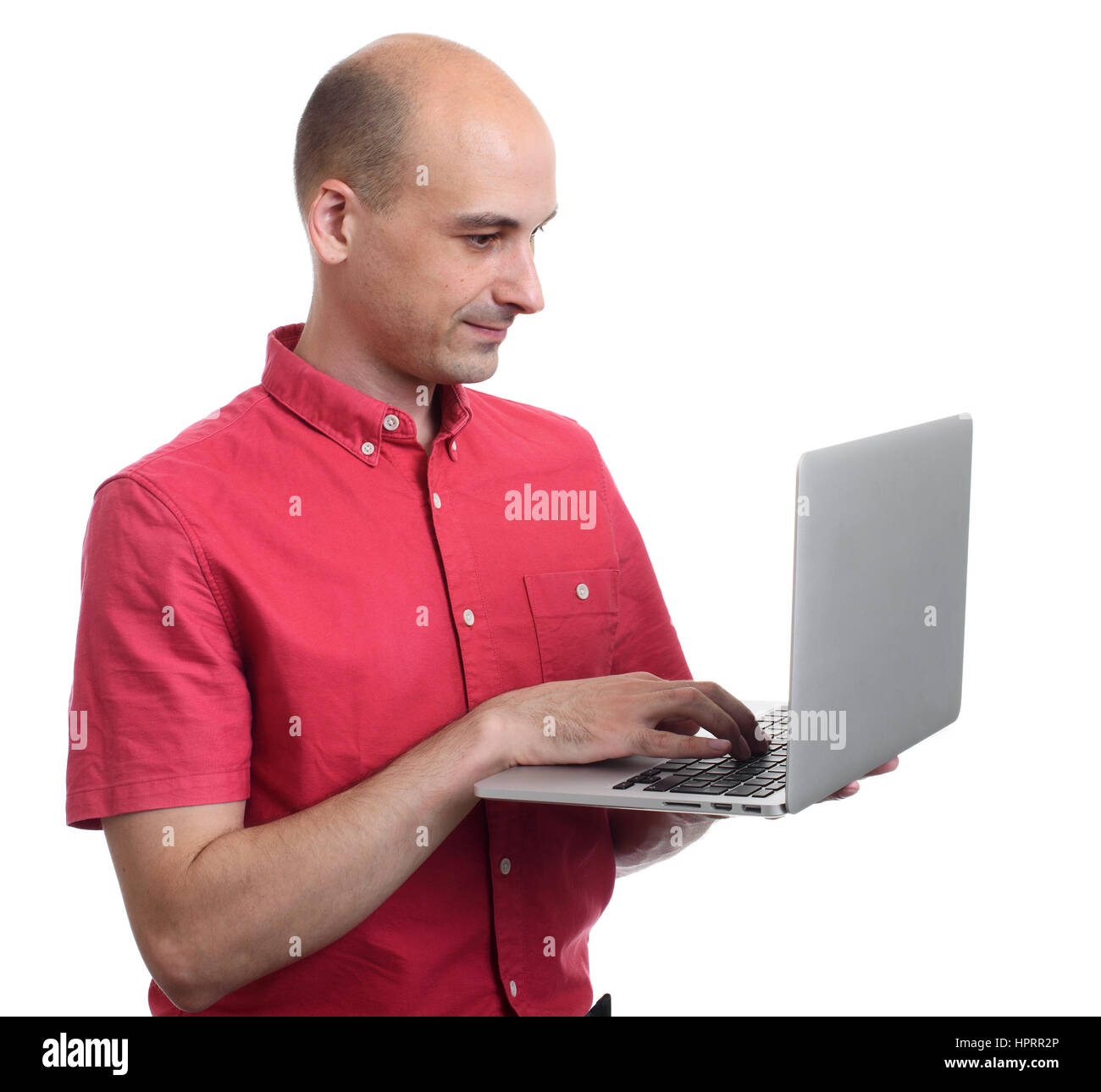 bald man using laptop. Isolated on white background Stock Photo - Alamy