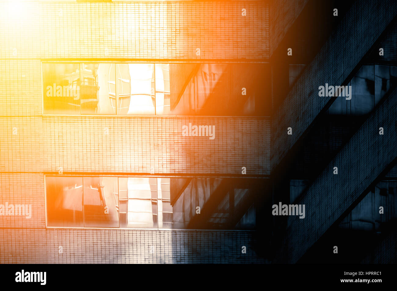 Modern office building close up in sunlight Stock Photo - Alamy