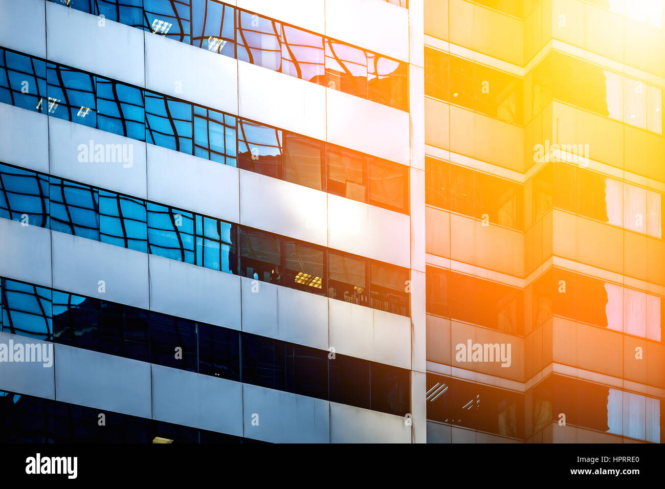 Modern office building close up in sunlight Stock Photo - Alamy