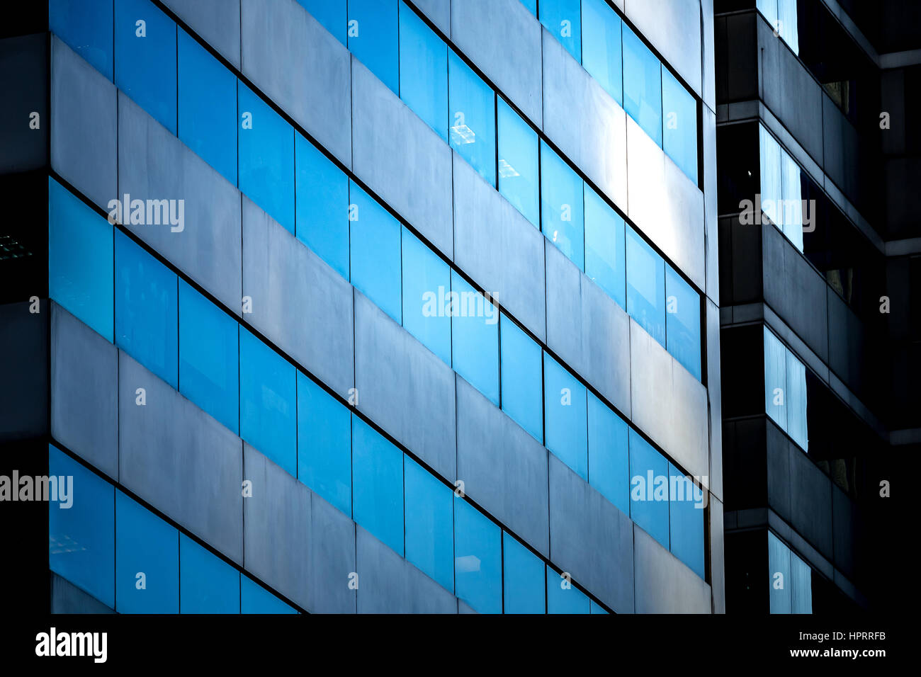 Modern office building close up in sunlight Stock Photo - Alamy