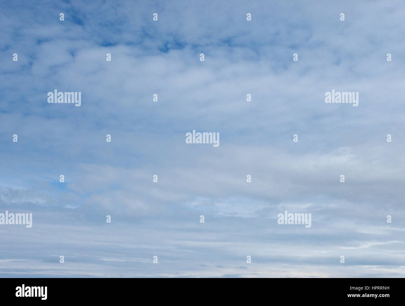 Blue sky with clouds useful as a background Stock Photo - Alamy
