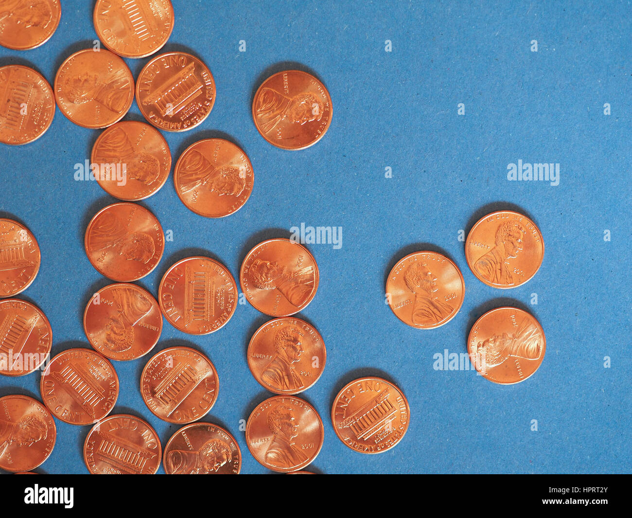 One Cent Dollar coins money (USD), currency of United States over blue ...