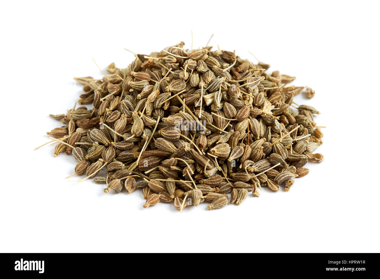 Pile of of dried anise seed (aniseed) isolated on white background