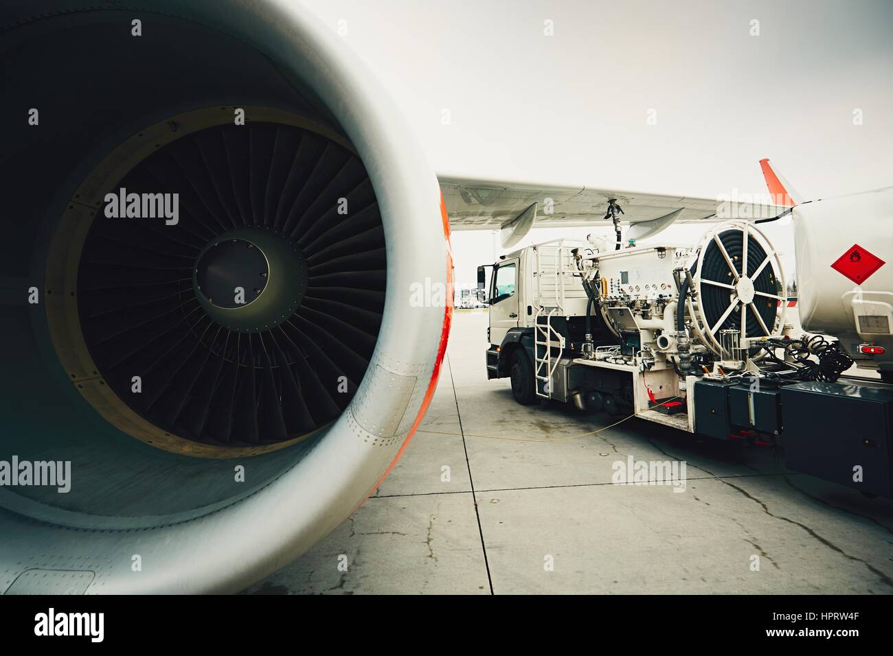 Process of the refueling passenger plane at the airport Stock Photo