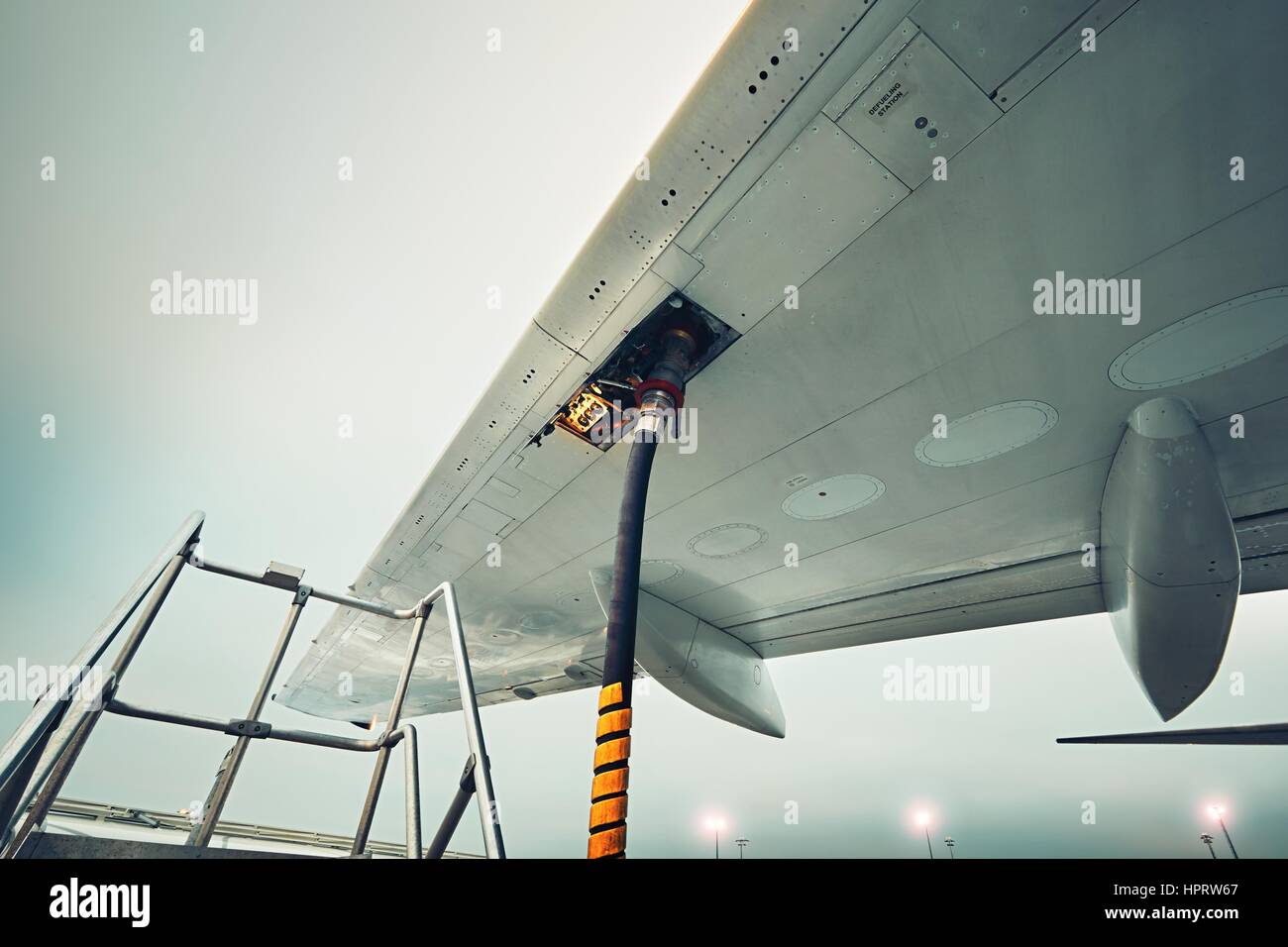 Process of the refueling passenger plane at the airport Stock Photo