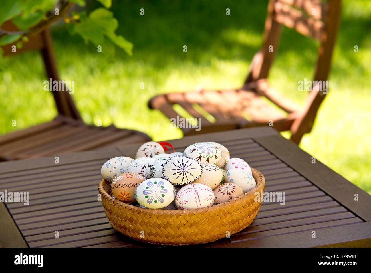 Easter Eggs On The Wooden Table In The Garden Stock Photo