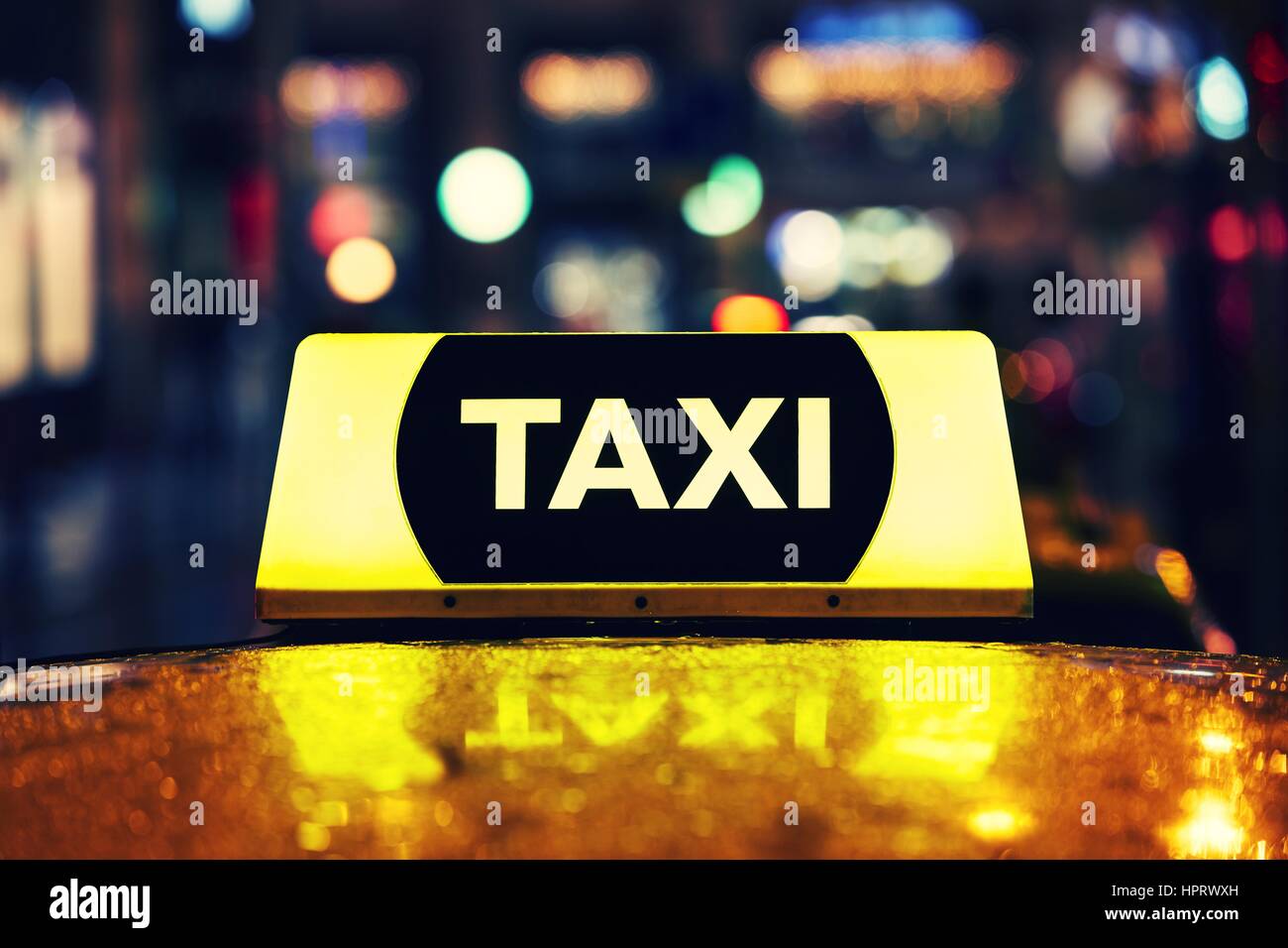 Taxi car on the street at night Stock Photo