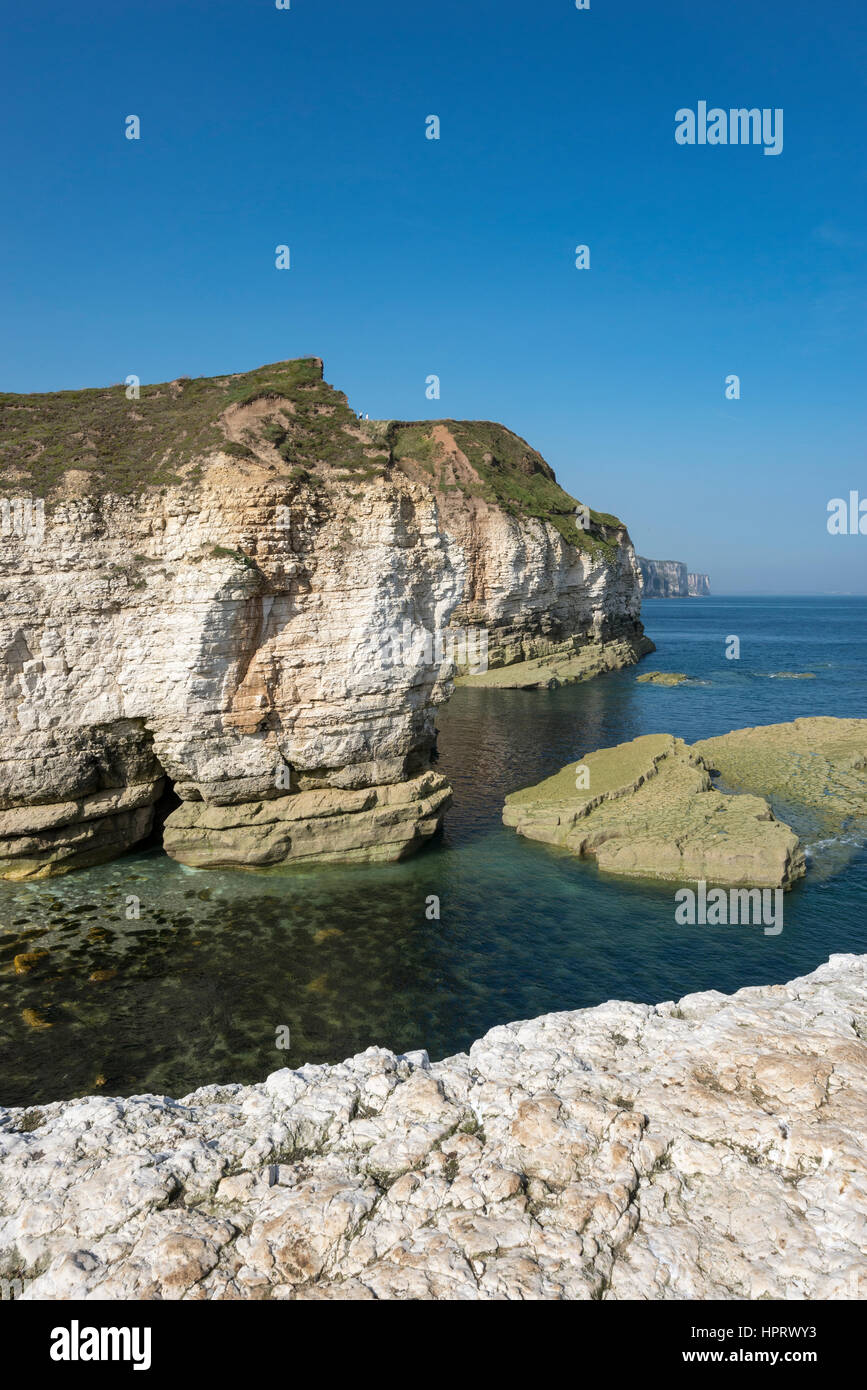Beautiful pebbly beach at Thornwick bay, Flamborough head on the  east coast of England. A popular tourist destination with stunning scenery. Stock Photo