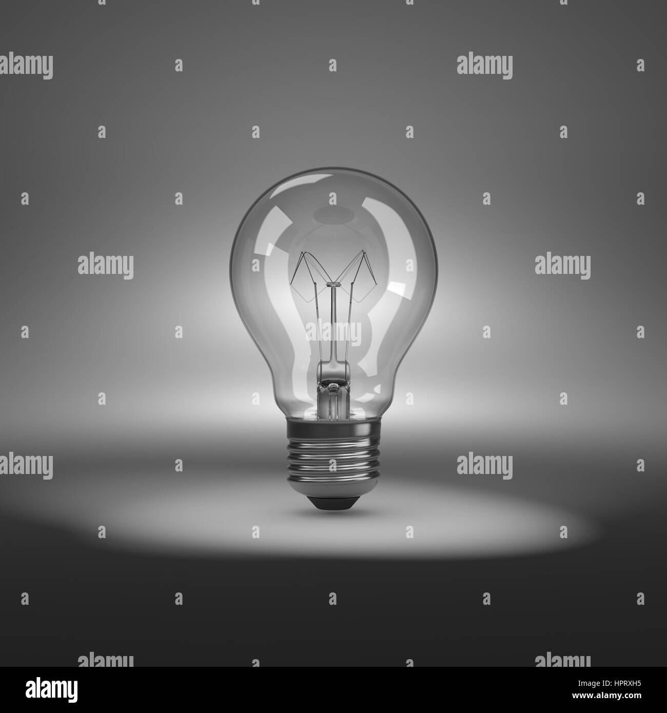 One Single Light Bulb under Spotlight Stock Photo