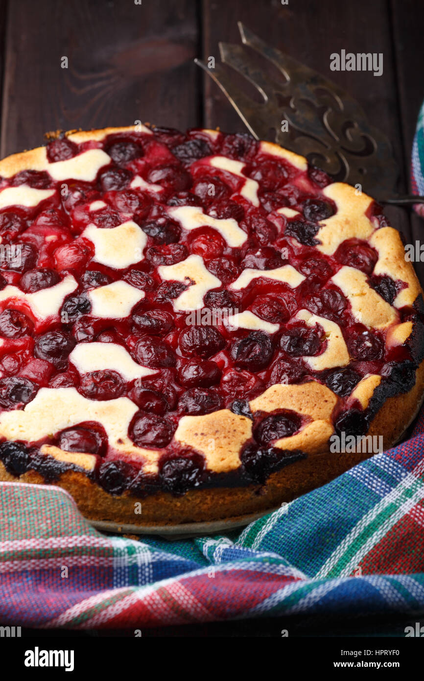 Homemade cherry pie on rustic background with vintage blade Stock Photo ...
