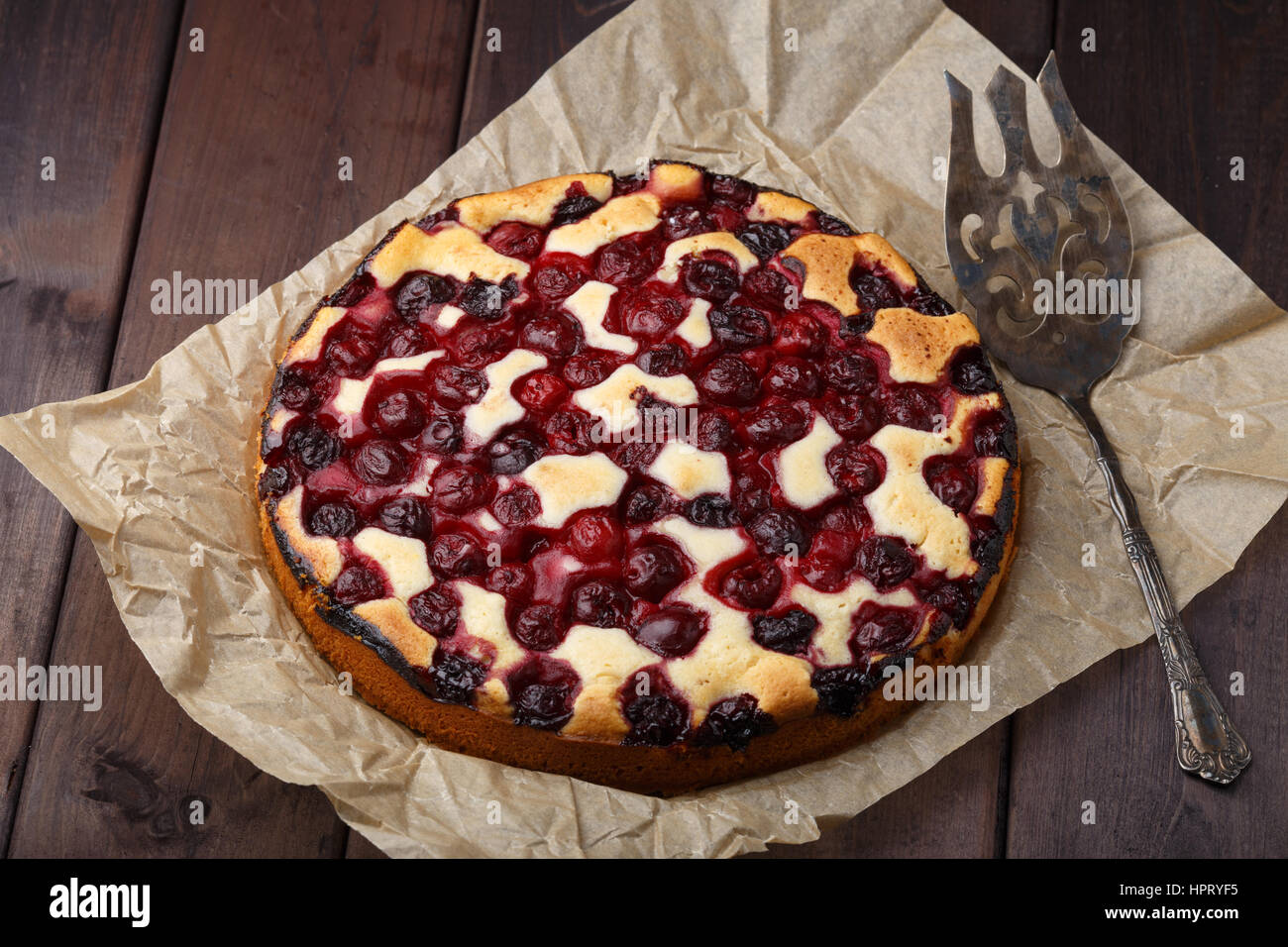 Homemade cherry pie on rustic background with vintage blade Stock Photo ...