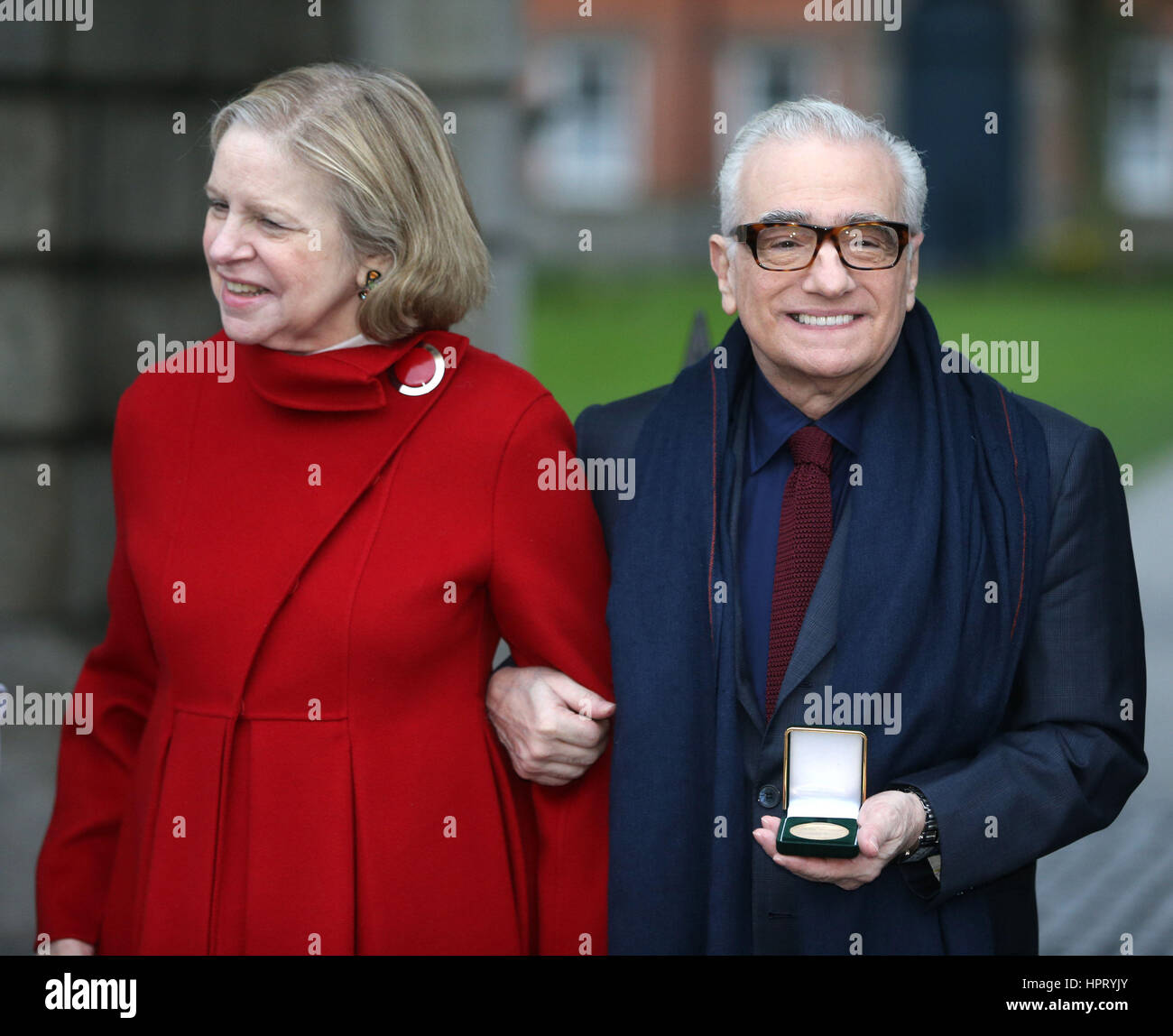 Film director Martin Scorsese (right), with his wife Helen Morris, holds a gold medal awarded to him by students of Trinity College's debating society, the Philosophical Society at Trinity College in Dublin. Stock Photo