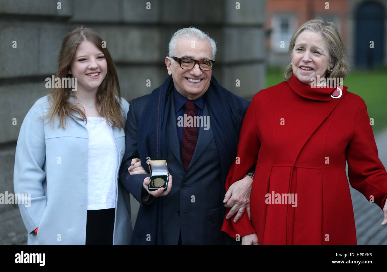 Film director Martin Scorsese (centre), with his wife Helen Morris (right) and daughter Francesca, holds a gold medal awarded to him by students of Trinity College's debating society, the Philosophical Society at Trinity College in Dublin. Stock Photo
