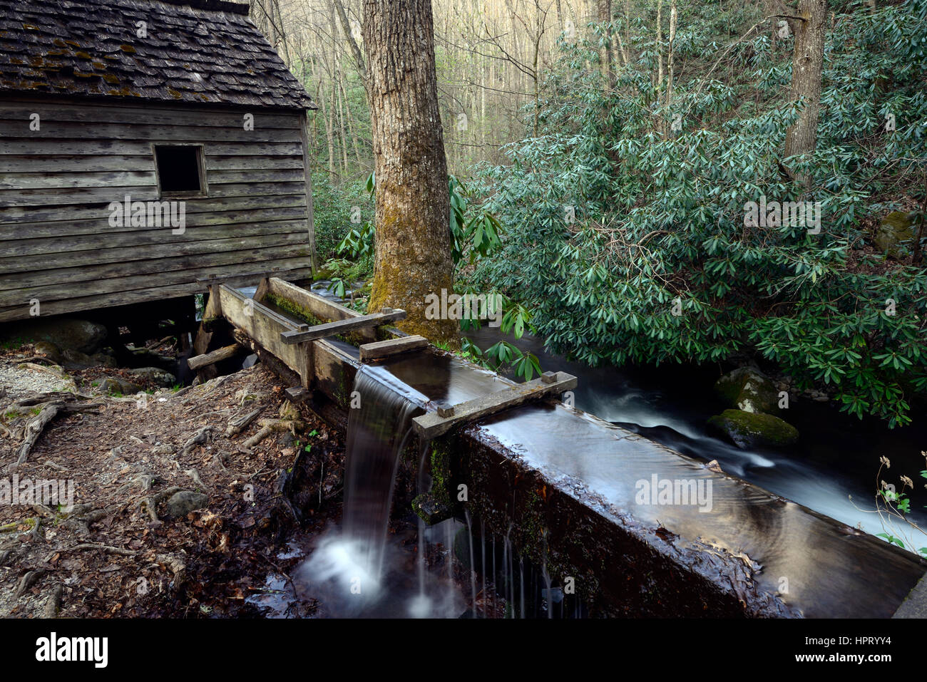 The Reagan Grist Mill, water power, water powered, mills, tub-wheel turbine, flume redirecting water, grindstone, log cabins, cottage, homestead, hous Stock Photo