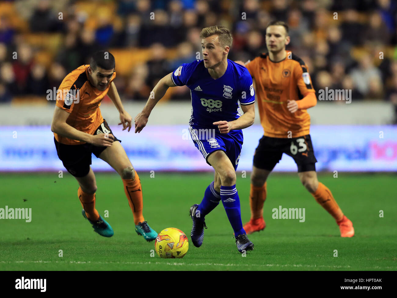 Birmingham City's Maikel Kieftenbeld (centre) and Wolverhampton Wanderers' Conor Coady (left) in action during the Sky Bet Championship match at Molineux, Wolverhampton. Stock Photo