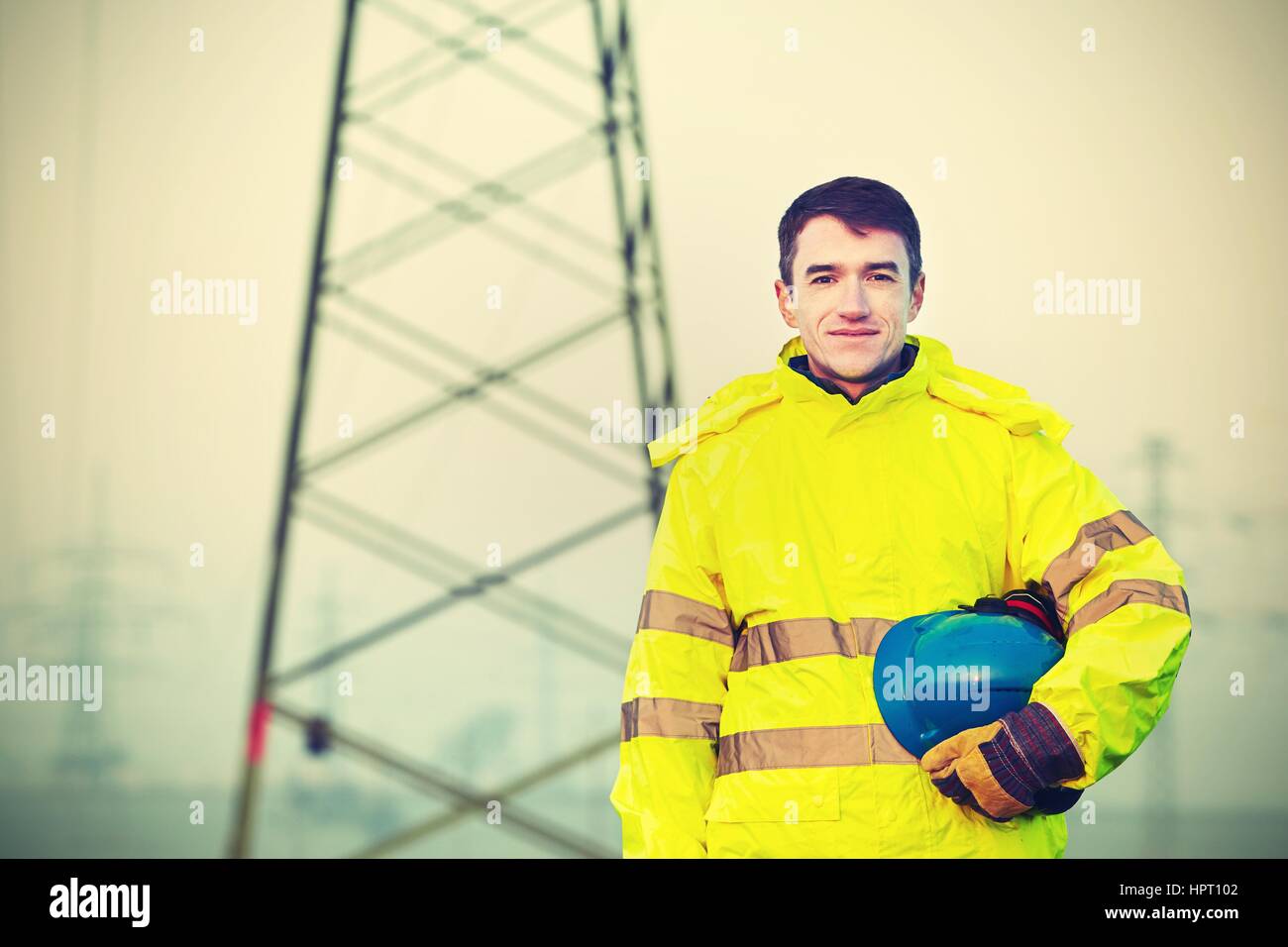 Worker wearing reflective clothing with helmet Stock Photo Alamy
