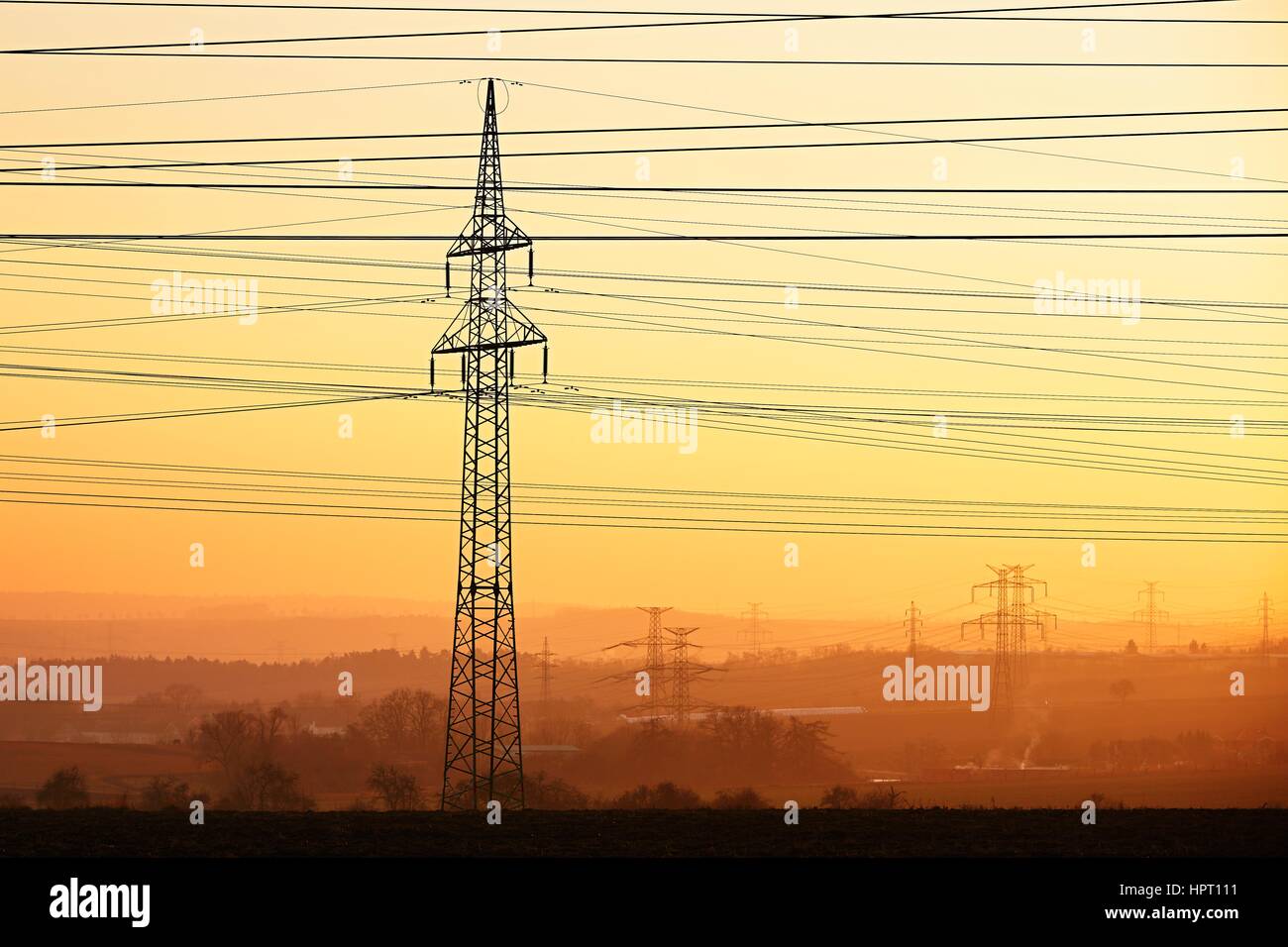 Silhouette electricity pylons during sunset - Czech Republic Stock ...