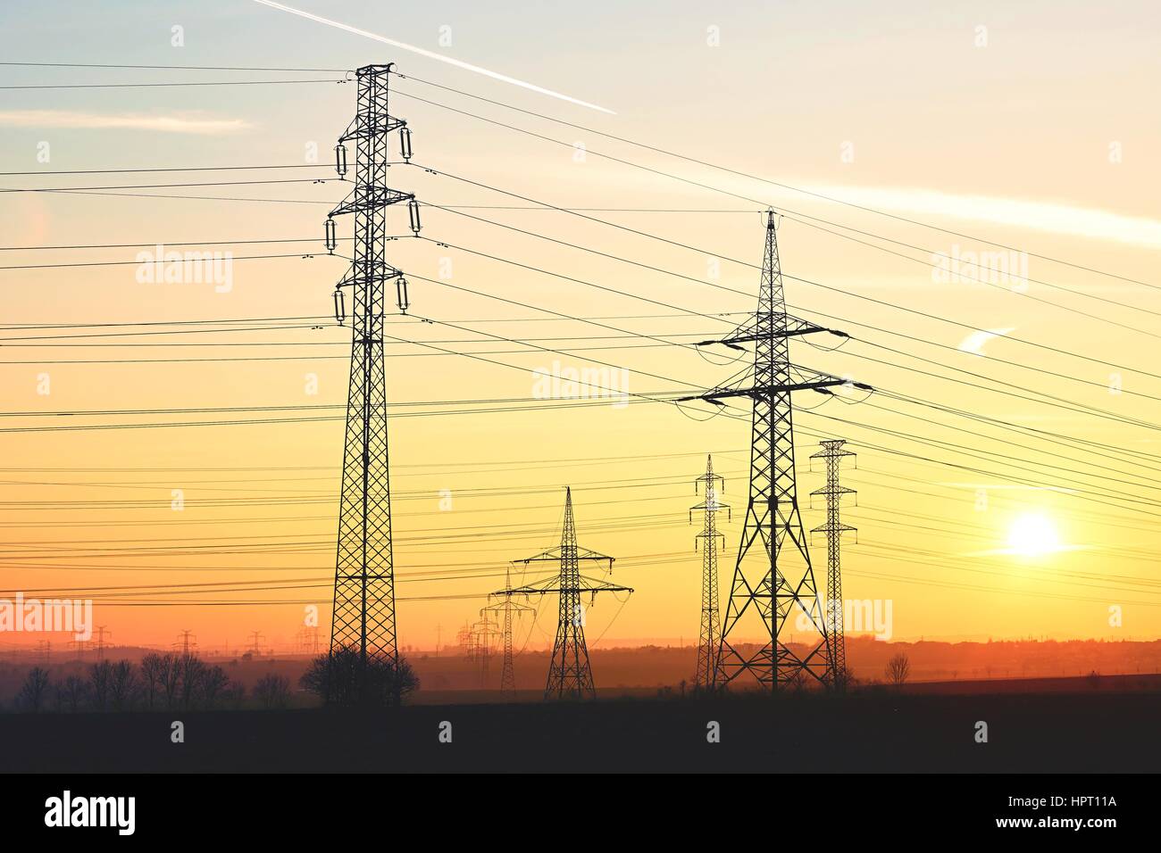 Silhouette electricity pylons during sunset - Czech Republic Stock ...