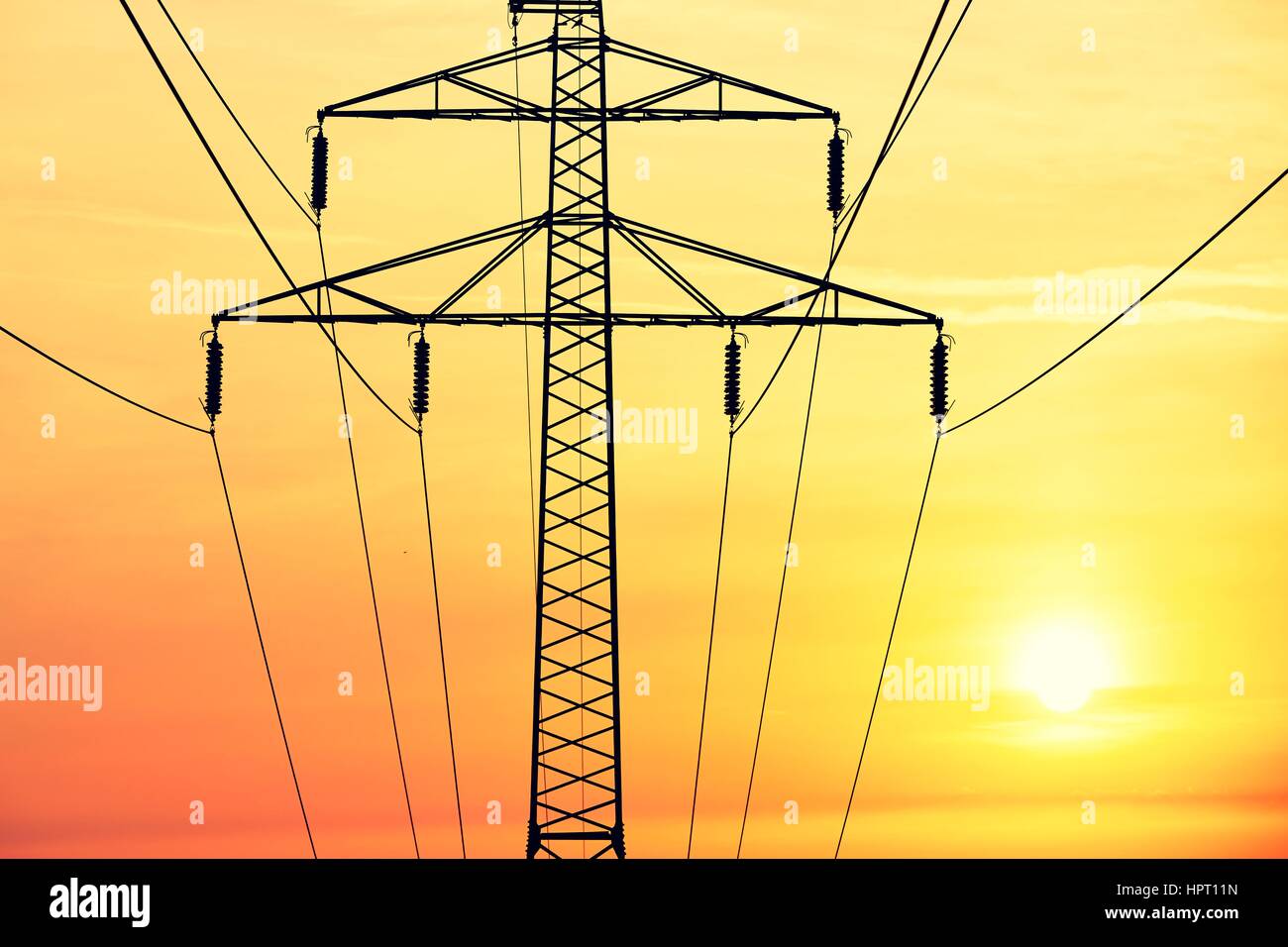 Silhouette of the electricity pylon at the sunrise Stock Photo - Alamy
