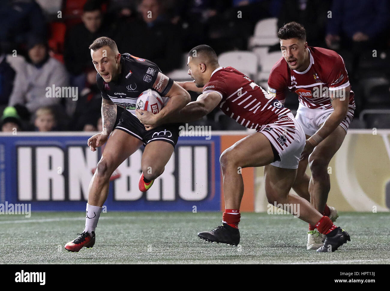 Widnes Vikings Danny Craven is tackled by Wigan Warriors Willie Isa during the Super League match at the Select Security Stadium, Widnes. Stock Photo