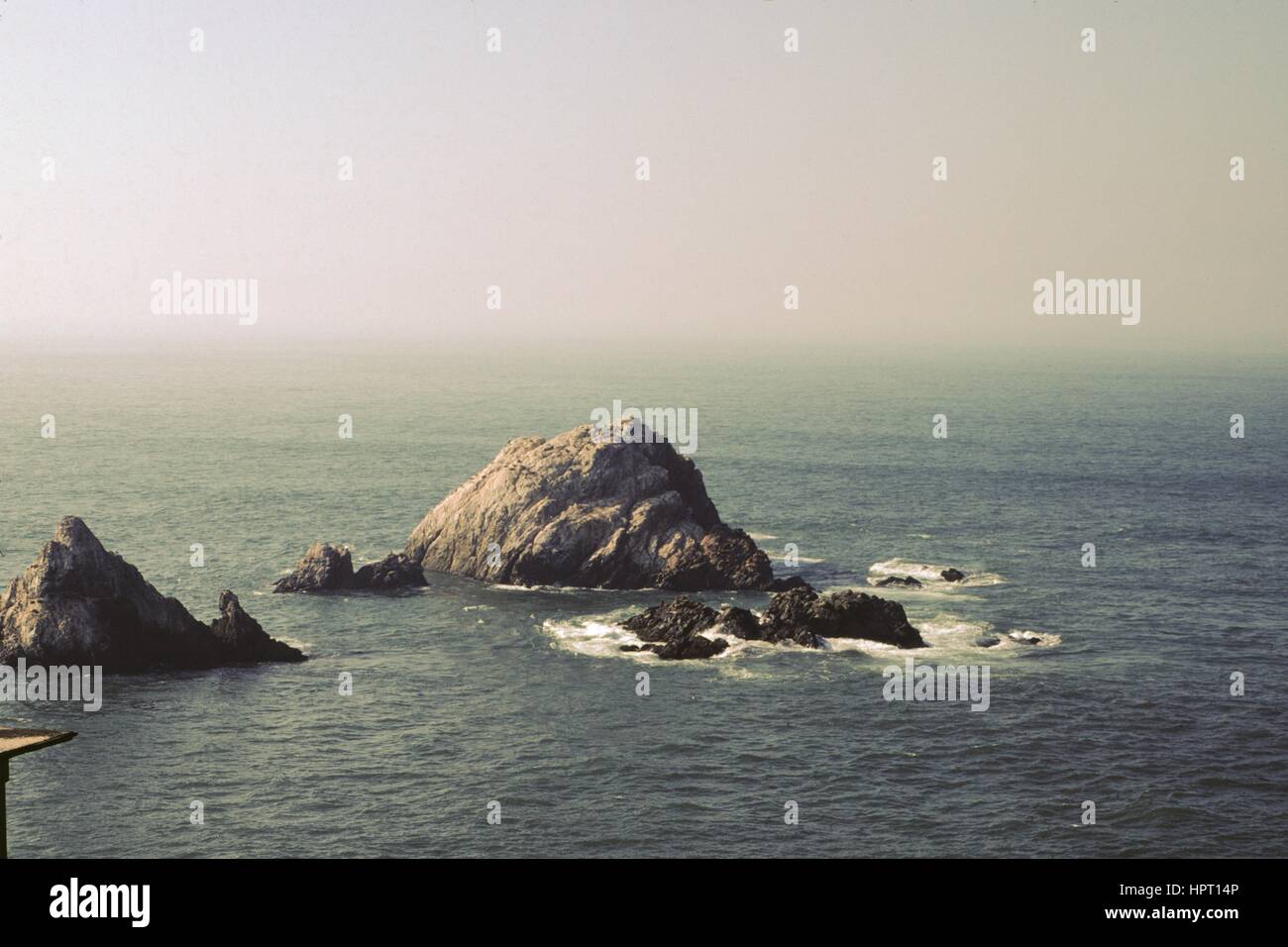 View of the Seal Rocks off the coast, viewed from the Cliff House in the Land's End neighborhood of San Francisco, California, 1978. Stock Photo