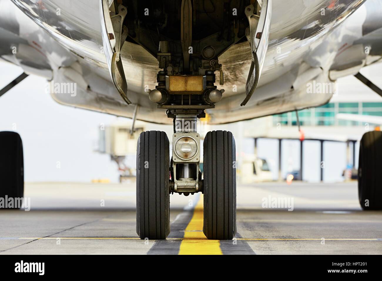 Airport - nose wheel of the aircraft Stock Photo