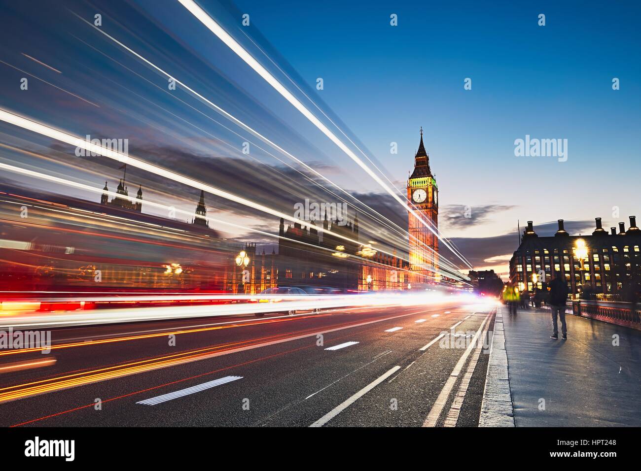 Light trails on the Westminster bridge after sunset. Big Ben and House of Parliament in London, The United Kingdom of Great Britain and Northern Irela Stock Photo