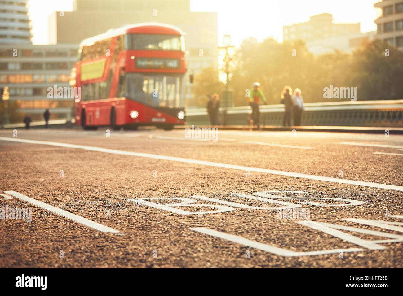 Daily life in the city. Bus lane and bus of the public transport on the street. London, The United Kingdom of Great Britain and Northern Ireland Stock Photo