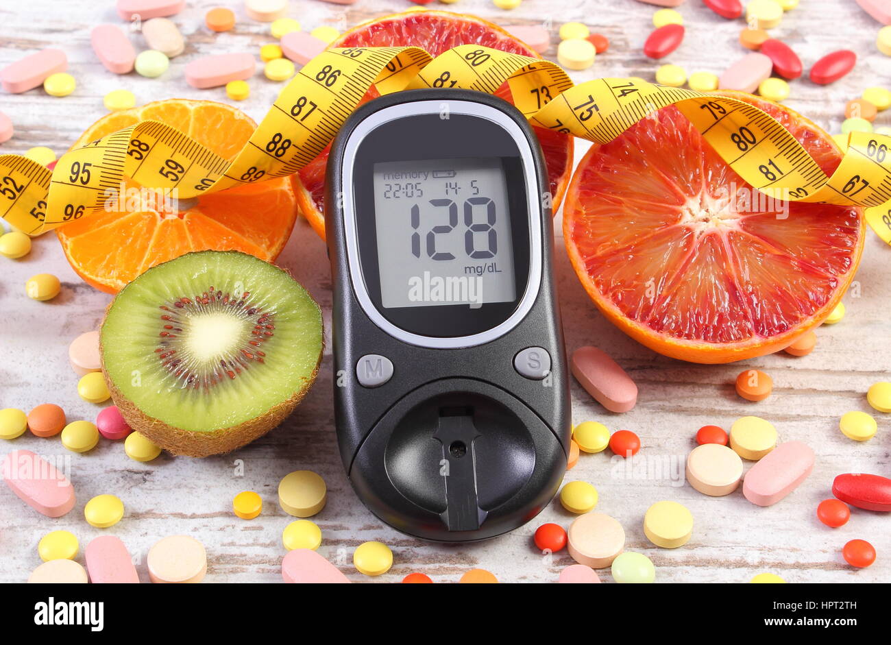 Glucose meter for checking sugar level, blood pressure monitor, fresh  fruits with vegetables and tape measure, slimming, diabetes and prevention  of hy Stock Photo - Alamy